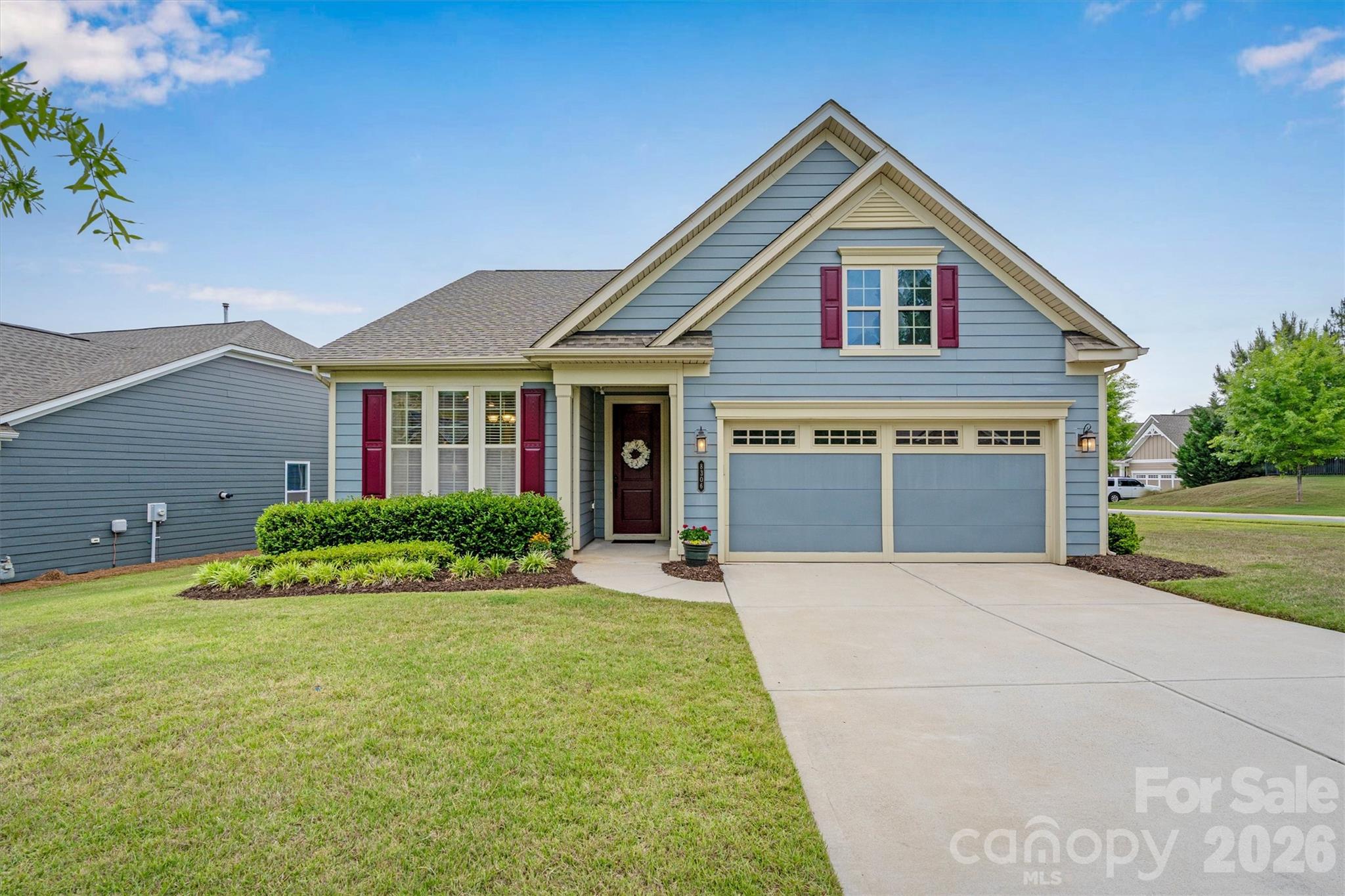 Beautifully maintained and PRICED TO SELL, this popular Ashford model offers the perfect blend of comfort, style, and peace of mind! Freshly painted throughout the entire interior, this move-in ready home also features refreshed landscaping plus recently painted shutters and front door for fantastic curb appeal - all situated on a desirable corner lot. Inside, you’ll find 2 bedrooms, 2 full baths, gorgeous WOOD floors throughout with NO carpet anywhere, elegant 5” crown molding, 7¼” baseboards, and 2” faux wood blinds throughout. The beautifully appointed Kitchen features "Nutmeg" cabinetry, granite countertops, under-cabinet lighting, pot drawers and roll-outs, a custom pantry, GAS stove and a large SS single-bowl sink. The inviting living area w/ extended Sunroom, is anchored by a charming gas vented FP while the spacious screened lanai provides the perfect place to relax or entertain. The Primary Suite w/tray ceiling offers French doors leading into an ensuite bath with framed mirrors, zero-entry frameless shower w/grab bar and corner seat, and a handheld shower for added comfort and convenience. Additional highlights include overhead Laundry Room cabinets, attic pull-down stairs for light storage, and one of the home’s most valuable features - a whole-house GENERATOR providing year-round peace of mind. And...irrigation water is covered by the HOA on this home! Don’t miss this opportunity to own a beautifully updated home with one of the community’s popular floorplans!