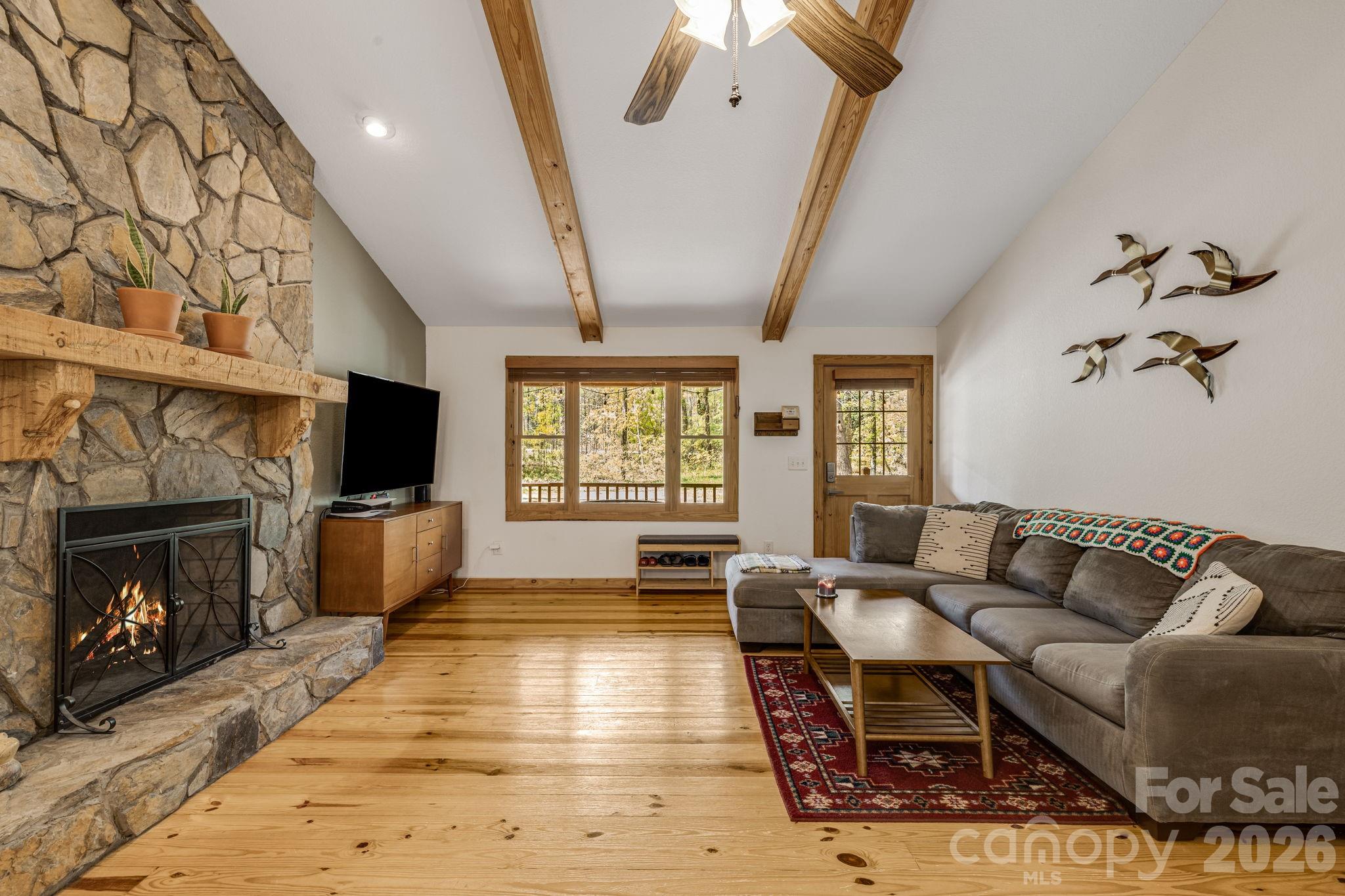 Meticulously maintained and full of charm, this 2 bed, 2 bath cabin is tucked away in the sought-after Riverbend community in Lake Lure. Surrounded by nature and thoughtfully cared for, this home offers the perfect blend of comfort, privacy, and outdoor adventure.

Step inside to an open-concept living space that feels both cozy and functional, ideal for a vacation rental, full-time living, or a peaceful mountain retreat. The sellers have taken great pride in ownership, with key updates including a brand new roof (2024) and full crawlspace encapsulation, offering peace of mind for years to come.

Enjoy quiet mornings with a book on the front porch, or unwind on the back porch off the primary suite overlooking a beautiful fire pit area. The private setting makes it easy to relax and recharge. Riverbend’s exceptional amenities truly set this property apart, featuring two private lakes, a sandy beachfront, access to the Broad River, scenic walking trails, a community waterfall, picnic areas, and an outdoor pavilion perfect for gatherings and grilling. With kayaking, canoeing, fishing, and hiking opportunities both inside the gates and beyond, this is an outdoor enthusiast’s paradise.