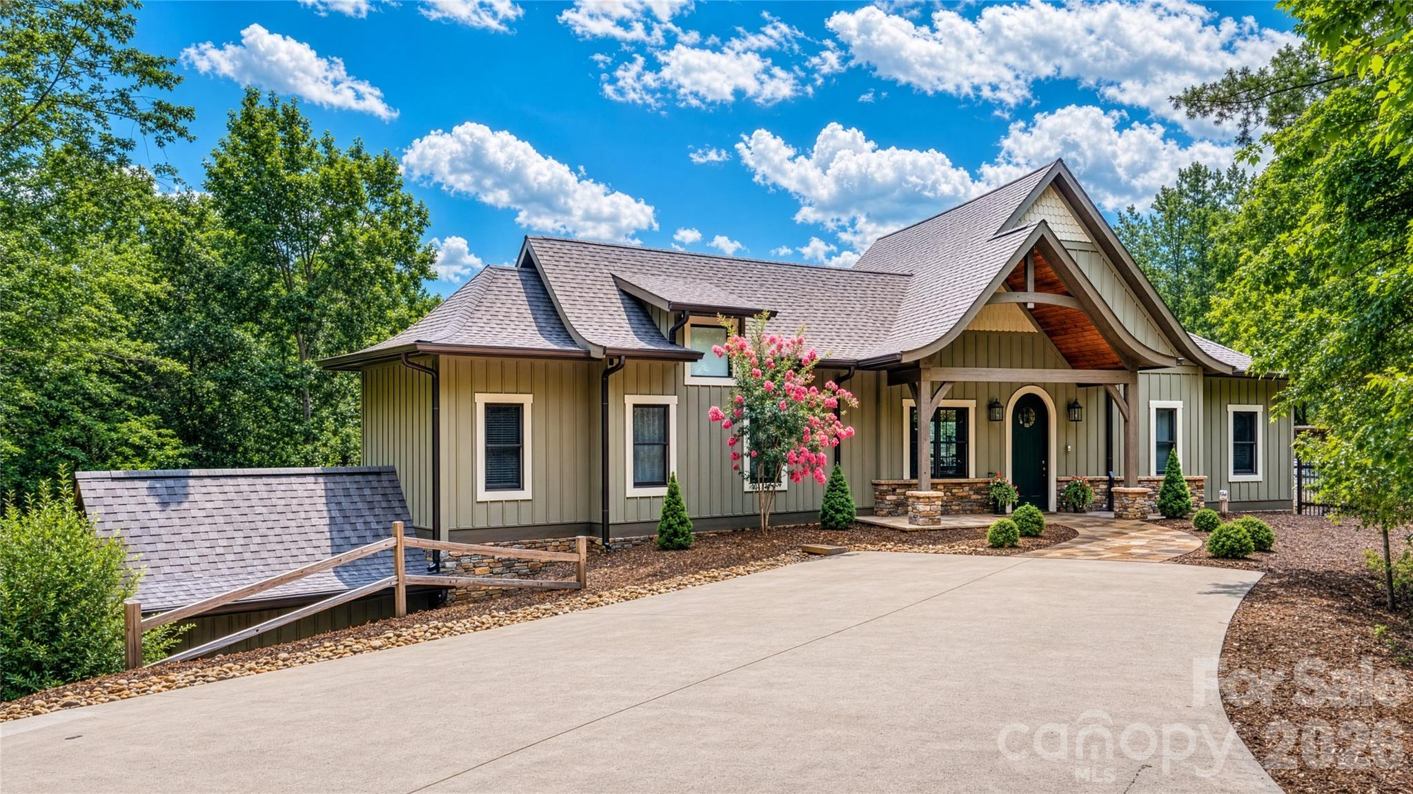 Whether you are searching for a full-time residence or a weekend escape, this charming cottage awaits you! Tucked into the woods for privacy and perched high above majestic Lake James with year-round mountain and lake views, this custom-built 3 bedroom/2.5 bath home has so many details. You are welcomed with a circular drive, beautiful stone walkway and whimsical gas lanterns onto the covered front porch. Enter into the great room with cathedral beamed ceilings and a view facing the lake. This room also features a gas fireplace showcasing antique tiles. With an open floor plan this room encompasses the dining and kitchen area with unique granite countertops, a breakfast bar, tiled backsplash, gas range and SS appliances. The butler's pantry is conveniently located off the kitchen. Relax in the cozy den with an electric fireplace surrounded with beautiful hand-worked shelving and a private 1/2 bath featuring a copper sink. Or enjoy the breeze off the lake while relaxing on the screened porch or by the pool area. With trek decking and stone pavers, the heated and cooled pool features a sitting ledge, has a retractable pool cover and can be enjoyed all year while overlooking the lake. The primary en-suite is located on the main level and includes 2 walk-in closets and the laundry area. The luxurious bath features a double vanity, tiled steam shower and water closet. Easy access to the finished basement via elevator or oak steps with carpet runners and iron spindles. This finished area offers flex space and can be used as a family room or gym area. This level also has a bedroom and full bath displaying a Victorian dresser with marble top as the vanity. An extra bedroom or study area is also available on this level. The mechanical room, storage room and UTV or golf cart garage area is accessible as well. This property includes Boatslip #1. No short-term rentals allowed. Propane tank is buried and serviced by Blue Ridge Energies. Termite bond is transferrable. Starlink internet. Duke Energy. Surround sound. On demand HW heater. 2 HP w/ 5 zones. Ring doorbell w/cameras. Cummings generator. All furnishings (excluding artwork) are negotiable.