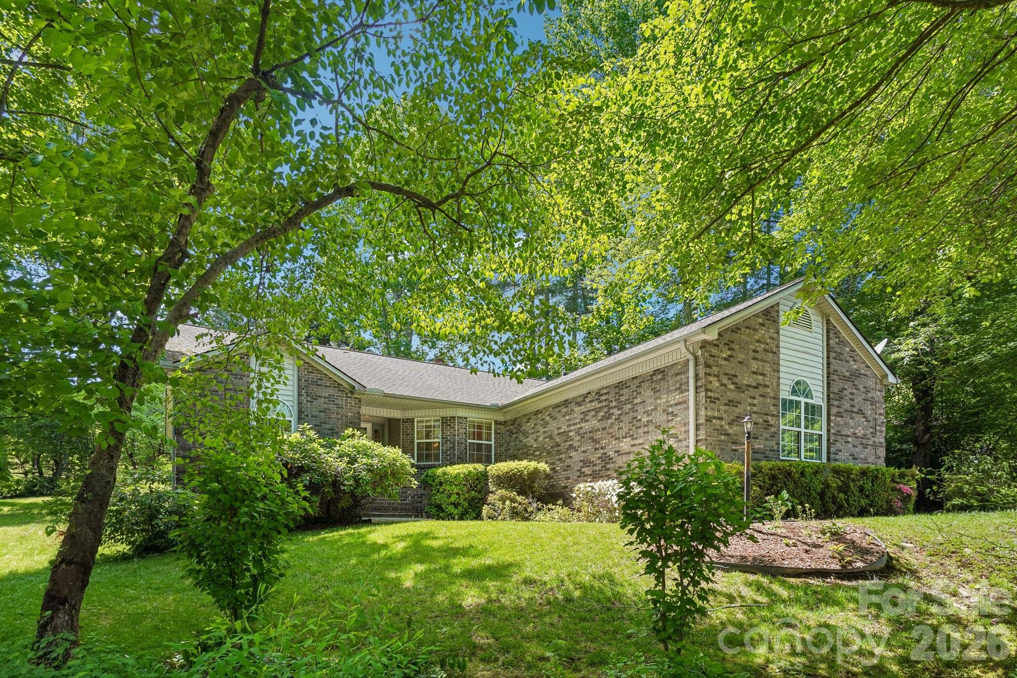 Welcome home to this charming three bedroom, two bath residence in the highly desirable Etowah's Reach community. Featuring one level living with a split-bedroom floor plan, this home offers both comfort and privacy. The inviting living room is anchored by a cozy natural gas log fireplace, creating the perfect gathering space for family and friends.
The spacious primary suite provides a relaxing retreat with an en-suite bath, while the bright and airy four-seasons room offers the ideal spot to enjoy morning coffee, read a book, or take in the beauty of every season. Step outside to the large back deck, perfect for entertaining, grilling, or simply enjoying the peaceful surroundings.
 A convenient laundry room located just off the kitchen, and a two-car garage providing ample storage and functionality.
Residents of Etowah's Reach enjoy exceptional community amenities, including a clubhouse, outdoor swimming pool, tennis courts, and pickleball courts. Conveniently located near grocery stores, restaurants, and outdoor recreation, this home offers easy access to Pisgah National Forest, as well as the towns of Brevard and Hendersonville.