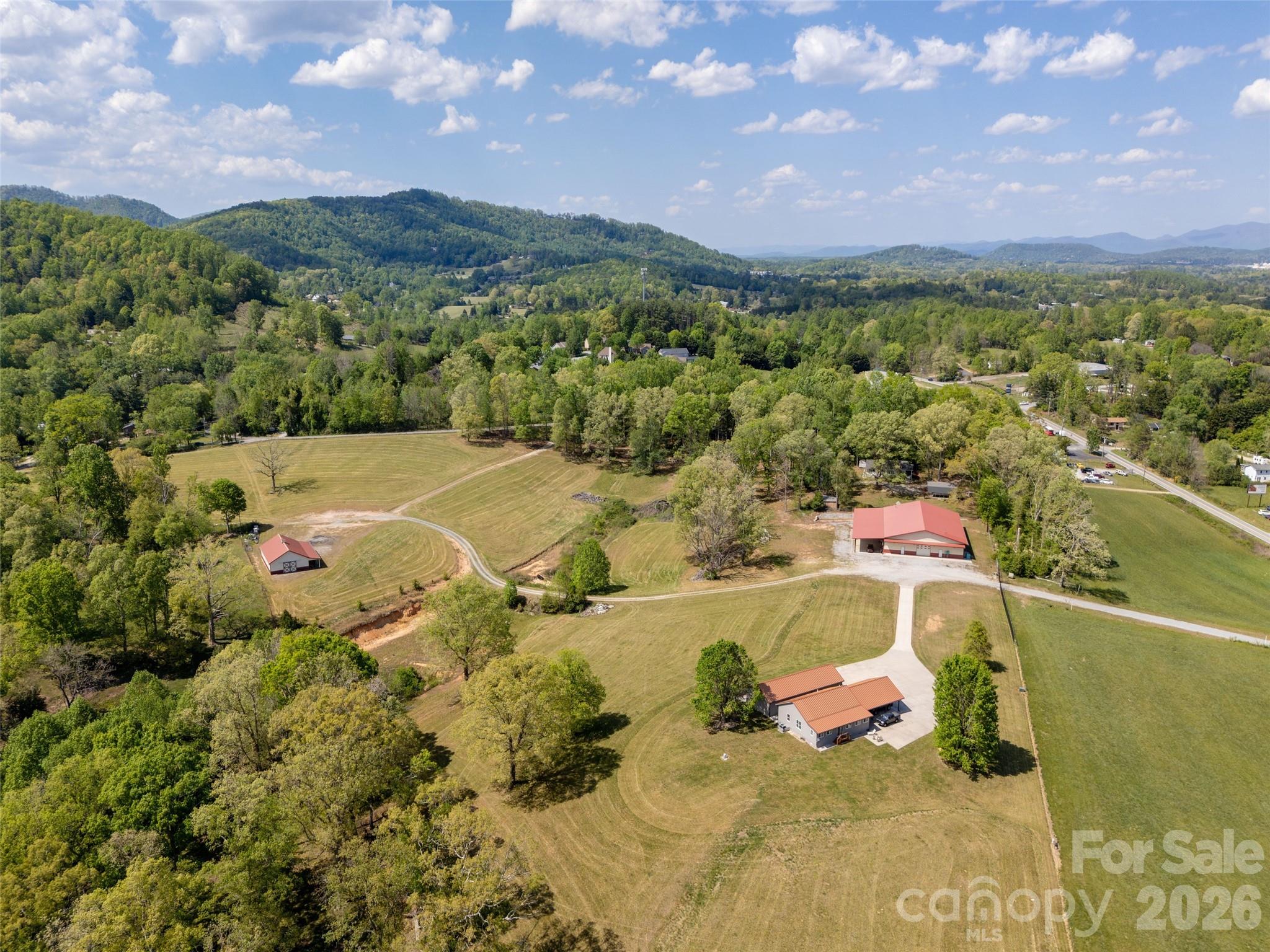 Discover an extraordinary opportunity offering unmatched potential for residential subdivision, eventing, lifestyle or institutional mixed-use development. Acquire this 5.45 acre portion or the whole 40.69 acres to create a magnificent family retreat, mixed-use community or equine class estate! Located 5 mins from AVL Regional Airport, interstate access and within blocks of the new Publix shopping center (under const), the location affords easy access to Mills River retail and business services.  

This property features a 1,595 SF dwelling with oversized detached garage resting atop a gorgeous mountain top setting overlooking lush rolling pastures and offers remarkable views of distant mountain ridges! Envision adaption of the residential structure as ancillary quarters to a much larger development concept or consider purchase of the "whole" to create an unprecedented, estate or institutional class property ideally suited for large estate plotting, a private family compound or multi-purpose retreat!   

Subject to seller discretion with regard to the timing of a sale of any part of the larger whole, this property is offered individually or, collectively as part of the whole. Adjacent properties include a small warehouse structure and Morton Barn on 12.29 acs immediately north, lush rolling pastoral lands to the south and upscale single family homes to the west. Transformation of the adjacent warehouse structure into an event center, recreational space or institutional learning facility would be an ideal fit with the surrounding landscape (subject to buyer confirm of any contemplated land use in light of the Town of Mills Rivers' potential adoption of a UDO). 

You be the visionary! Purchase and combine or re-purpose the entirety of land and improvements to achieve maximum utilization, enhance circulation and development flexibility! With multiple points of access, the property as a whole lays out well for a myriad of adaptive commercial, institutional or mixed use and offers a rare blend of scale, flexibility, and location! However you choose to utilize, expand, or reimagine this property, have confidence knowing a property of this caliber is rarely offered!