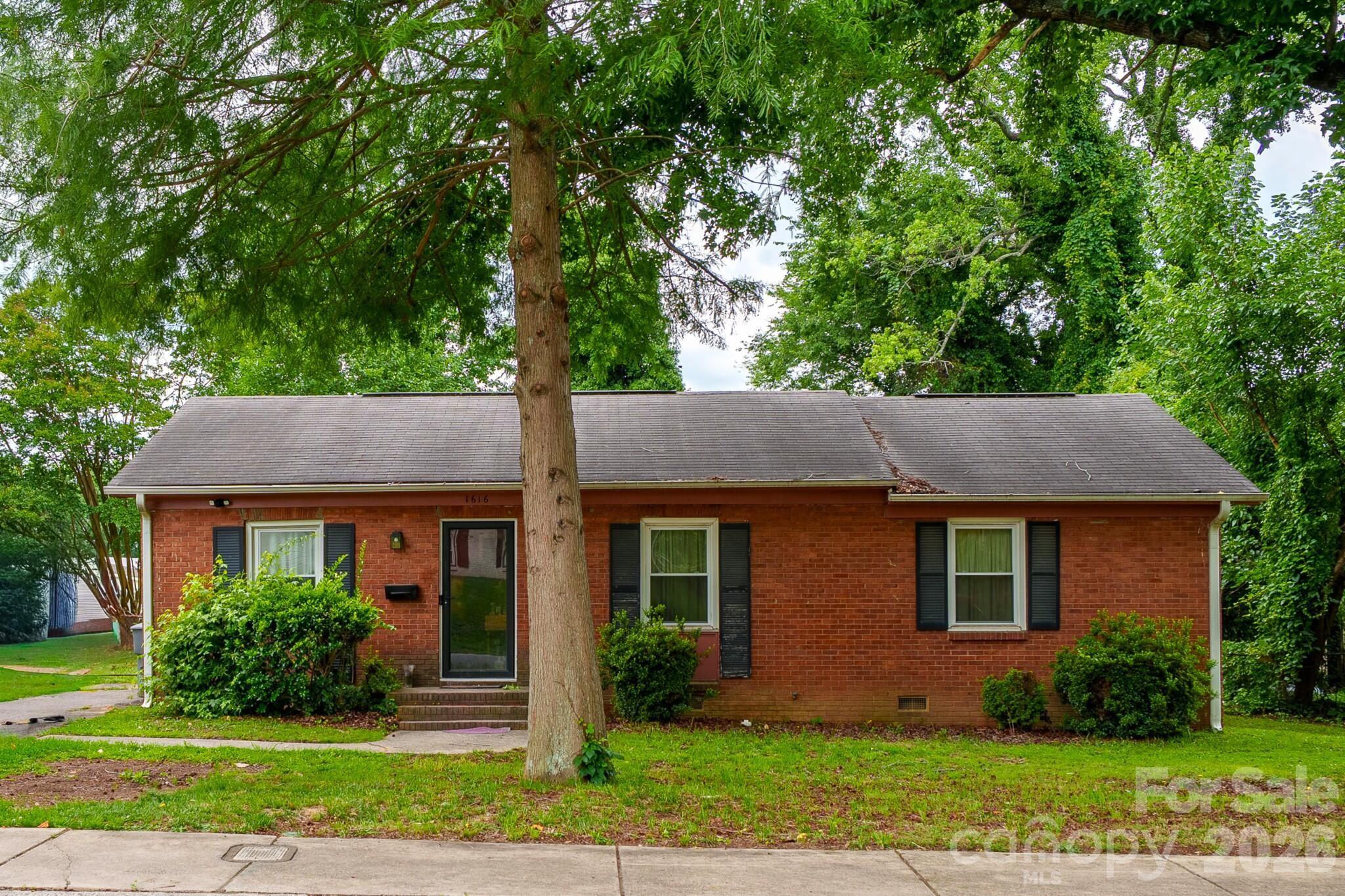 1616 McAllister Drive is a solid all-brick ranch in an established, quiet northwest Charlotte neighborhood, with the major updates already done. This single-level, three-bedroom, two-bath home features hardwood floors throughout, a brick fireplace, and an eat-in kitchen with stainless steel appliances. One full bathroom is already updated with a glass shower and modern vanity; the second is ready for an easy refresh. Behind the walls, the home has been fully repiped to the street, with a new water heater, updated electrical panel and meter, central air, and a shingle roof replaced within the last decade, so the big-ticket items are handled. Outside, enjoy a large fenced backyard with a patio and plenty of open space, all with no HOA and a low-maintenance brick exterior. Close to uptown Charlotte, major interstates, shopping, and dining. Bring your paint and finishing touches and make it your own.