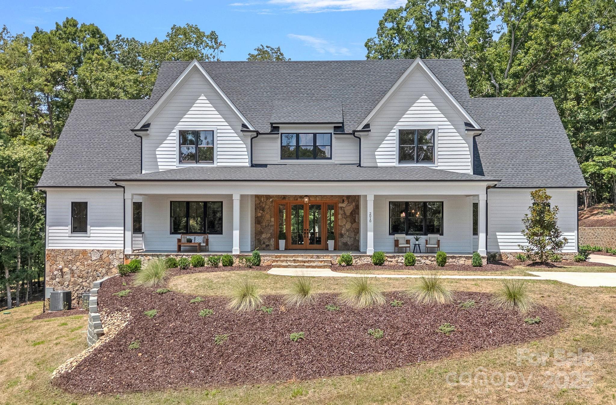 Design. Luxury. Privacy. Lifestyle. Exquisite properties like this do not come along often!  Located in the award-winning Fort Mill school district, and 10 minutes from the prestigious Palisades Country Club with a Jack Nicklaus-designed golf course. A rare find blending luxury, privacy, and top-tier location.  Every inch of this home has been carefully designed and curated to provide the ultimate lifestyle- custom cabinetry, high end appliances, elevated designer finishes throughout. An entertainer's dream with multiple gathering areas both indoors and out. Outside you will find a saltwater pool and spa, travertine decking, and a covered outdoor kitchen area. Beautiful sprawling front lawn provides a welcoming private setting to your beautiful estate.  Make this property yours, no HOA allows for limitless options.  Come live the life you've always dreamed about!