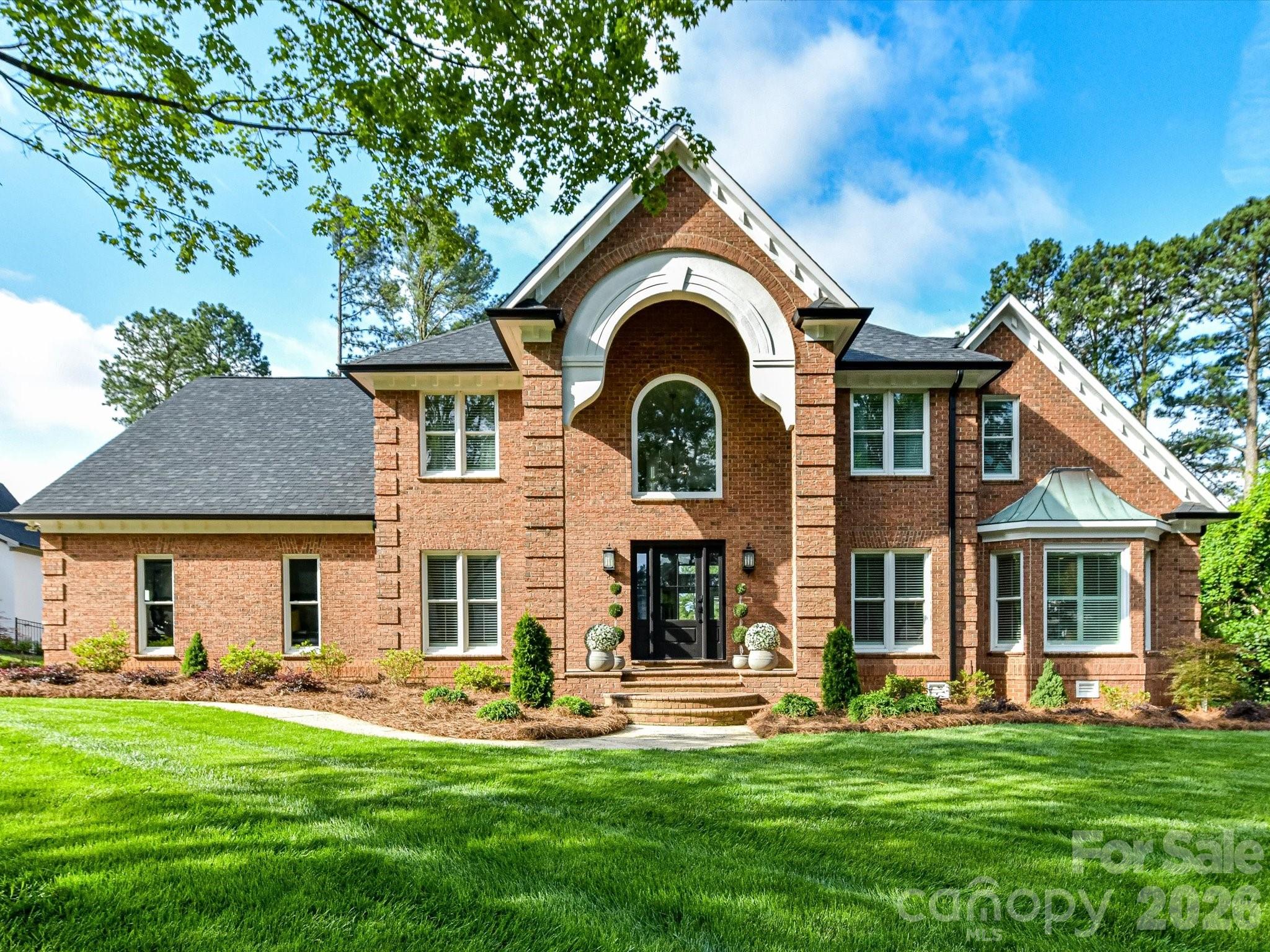 Completely reimagined luxury estate on one of Cabarrus Country Club's premier golf course lots overlooking the 1st green with panoramic views of four holes, resort-style pool/spa, detached guest quarters, and extensive top-to-bottom renovations. Opportunities like this rarely come available, where a completely reimagined luxury residence meets one of the most spectacular backdrops in the community.

From the moment you arrive, it becomes clear that this is far more than a home—it is a private resort designed for everyday living and unforgettable entertaining. The backyard is extraordinary, showcasing a custom saltwater gunite pool with elevated spa, expansive travertine decking, integrated drainage system, multiple outdoor gathering spaces, lush landscaping, custom landscape lighting, and panoramic golf course views that create an atmosphere unlike anything else in the area. Whether enjoying your morning coffee while watching golfers in the distance or hosting friends around the outdoor fireplace as the sun sets, the setting is simply exceptional.

The outdoor living spaces were designed with both comfort and entertaining in mind and include a beautiful screened porch with stone fireplace and gas log starter, expansive rear porches with premium Trex decking, and a covered outdoor kitchen and pool pavilion featuring LED fireplace accents and stainless cabinetry.

Inside this pre-inspected home, virtually every space has been renovated and upgraded with attention to detail and quality craftsmanship throughout. The home features all new hardwood flooring, carpet and tile, extensive custom cabinetry, upgraded quartz countertops, fresh designer paint, and beautifully renovated bathrooms with custom tile showers, tubs and new glass enclosures.

The kitchen has been completely transformed and serves as the centerpiece of the home with custom cabinetry, quartz countertops, and upgraded GE Café appliances with elegant white and rose gold accents. Designed for both everyday function and entertaining, it blends luxury and practicality seamlessly.

Major system improvements provide peace of mind and include new architectural roof shingles with copper flashing, all new windows, exterior doors, garage doors and openers, new PVC/PEX plumbing supply and drain lines, updated ductwork and HVAC servicing, new insulation and vapor barrier, commercial oversized gutters with gutter guards, whole-home mesh Wi-Fi system, smart lighting and home automation features, irrigation upgrades and much more.

Adding tremendous flexibility and value is the detached garage living quarters complete with a full kitchen, living area, bedroom, full bath and dedicated HVAC system—perfect for guests, multigenerational living, private office space, or extended stays.

Additional features include EV charging capability, integrated air compressor and pressure washer connections, fenced backyard with multiple gated entrances, and extensive professional landscaping.

Luxury homes can be renovated. Luxury homes can have pools. But it is incredibly rare to find a property where nearly every feature has been upgraded while also offering one of the most captivating golf course views in Cabarrus Country Club. This is a home that truly must be experienced in person.

Home was pre-inspected by a licensed home inspector of 15 years who said "easily one of the top five best homes I have inspected".  The 10 minor items have all been repaired as recommended by the inspector.

Golf cart will convey with acceptable offer (already registered and approved with Country Club). Golf cart easement off driveway lets you drive your golf cart to the Pro Shop or Restaurant in less than 3 minutes!