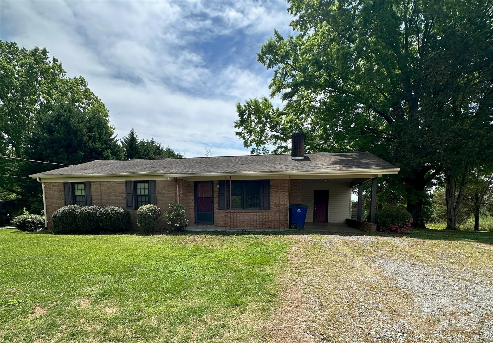 Brick ranch with storage shed and 2-story outbuilding with electricity would make a great workshop, storage area or playhouse with a deck. Large patio area for entertaining located off kitchen. Well on property but connected to city water. Double sinks in full bath, 3 bedrooms. Dining Room has storage closet. Laundry/utility room off carport. Lots of room for garden on .48 acre lot. Located near Hwy 16 and Conover shopping off Emanuel Church Rd.