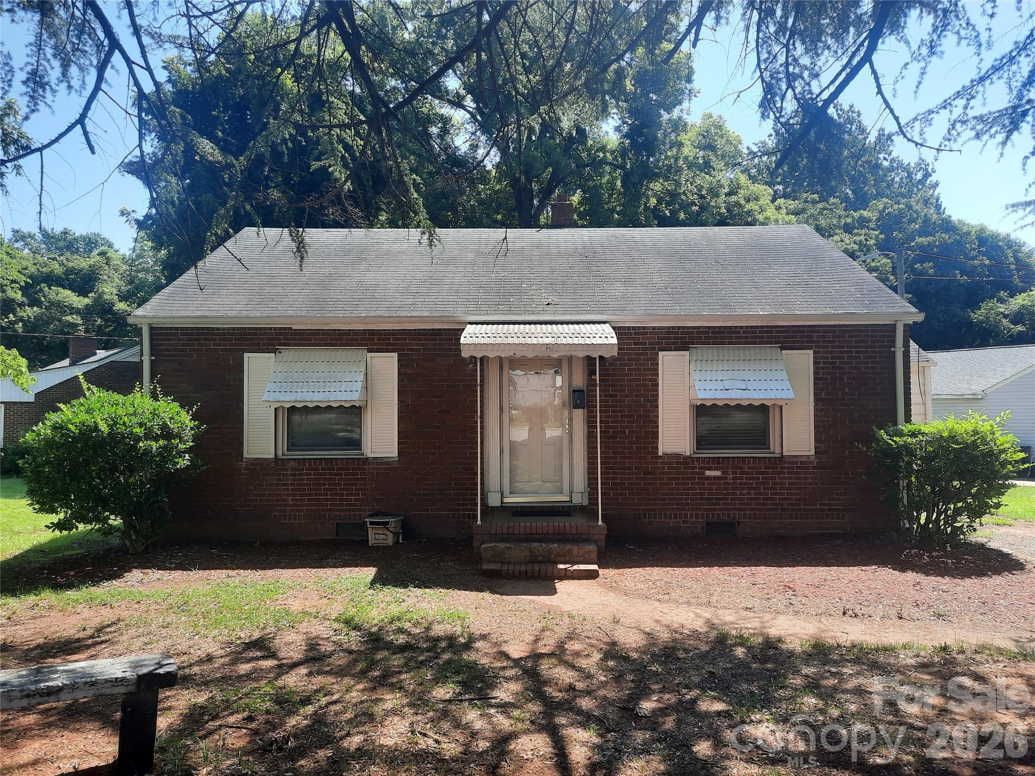 Location, Location, Location.  This is a wonderful opportunity to purchase a property in Charlotte. This house is located in one of the fastest growing sections of Charlotte. Minutes from Camp North End, less then 5 minutes from Uptown Charlotte plus easy access to I-77, I-277 and  I-85.  Restaurants, breweries, entertainment, Sporting arenas, shopping and more are all minutes away. The location is loaded with redevelopment and new constructions. Tons of possibilities for this property: come move right in and enjoy the charm of the house, or renovate the house with all the latest greatest new items, or tear it down and build something brand new.  This Brick ranch has 2 good size bedrooms 1 full bathroom, living room with dining area. Separate family room that can be use as a bonus room, bedroom, flex space or office. Kitchen has a washer and dryer connection. Large fenced back yard for your outside fun. Wonderful corner lot. The area is full of rapid redevelopment and growth. Come see all the the possible options available.  What a great place to call home.