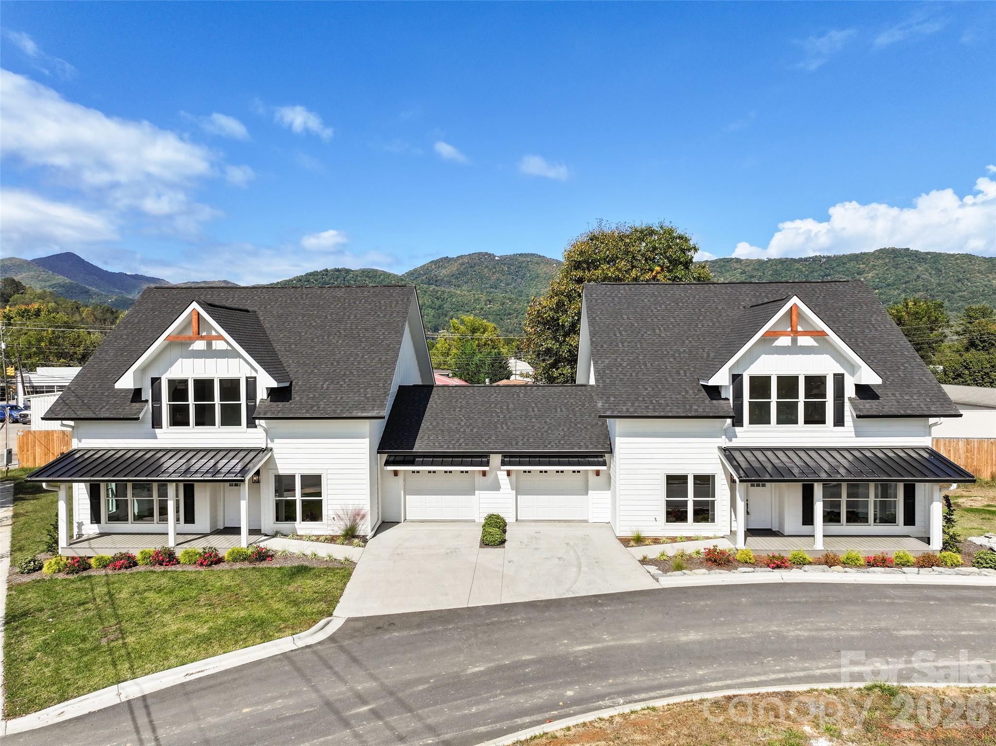 Welcome Home to Style, Comfort, and Location! This stunning custom-built duplex (Two newly constructed townhomes) offers the perfect blend of craftsmanship, modern design, and mountain-town convenience. Each unit features three spacious bedroom suites, each with its own full bath and walk-in closet, plus an additional half bath for guests, this residence delivers both luxury and livability.

Quality and detail shine throughout, from Andersen windows and durable concrete siding to granite countertops, custom flooring, and high-end LG appliances. Enjoy the comfort of natural gas, tankless hot water, and a single-car garage for added ease. Every full bath is thoughtfully designed with double vanities, creating the feel of a private retreat in every suite.

Just steps (or a short five-iron) from the Waynesville Inn & Golf Club, this duplex offers unbeatable proximity to downtown Waynesville’s shops, restaurants, and vibrant Main Street. Whether you’re looking for a primary home, vacation getaway, or income-producing rental, this property is it.

Only 30 minutes to Asheville and 20 minutes to the Blue Ridge Parkway and Great Smoky Mountains National Park, this townhome captures the very best of mountain living, modern comfort in a prime location.