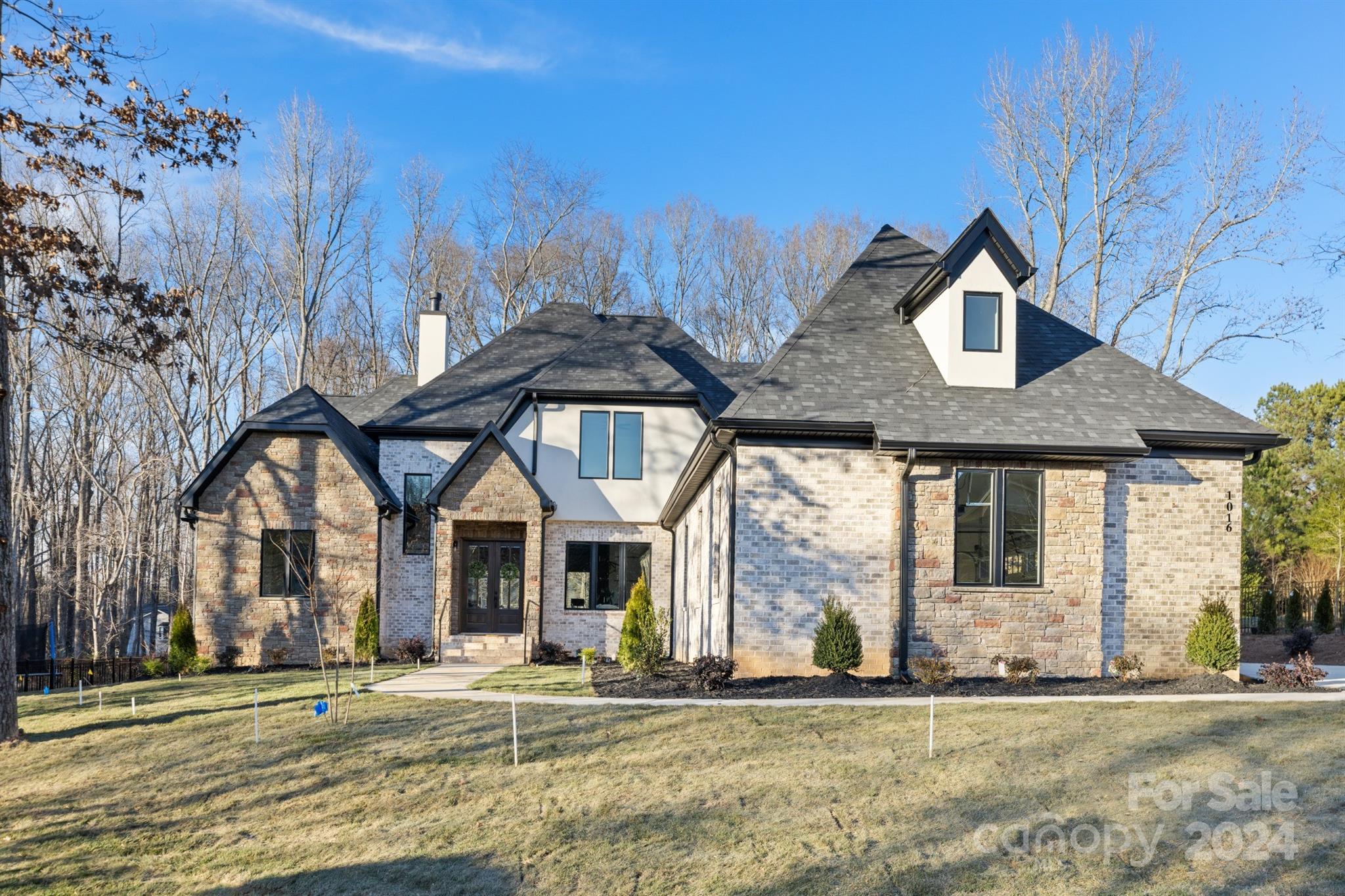Welcome to this beautiful new built home in desirable Waxhaw location. Custom cabinetry, high end appliances, a large island, pantry and coffee bar area make this a dream kitchen for entertaining. The great room has custom beam work, gas fireplace, built ins & expansive sliding glass doors that open to a gorgeous outdoor living area. Spacious primary suite on the main features luxury bathroom, & custom closets! Office and laundry are also conveniently located on the first floor.  Upper level offers 3 bedrooms with ensuite baths, bonus room & and an additional large rec/game room with a custom wet bar. The custom features, beauty and location of being just minutes from Waverly and I485 is one you won't want to miss.