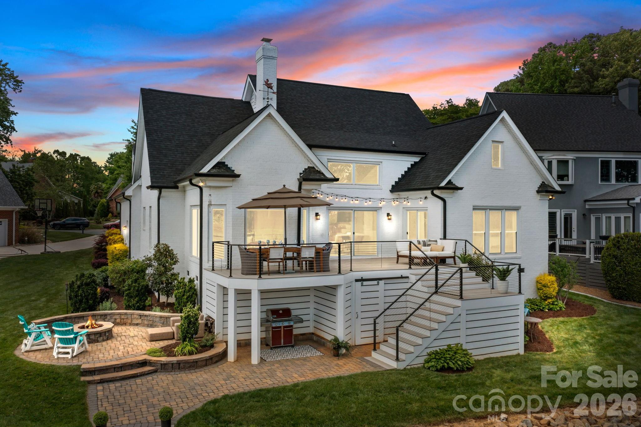 Exceptional waterfront gem in Cornelius under $2.1M. This well-maintained and recently updated home features 5BD/5BA providing the ultimate blend of luxury, convenience, and lake charm.  Conveniently located to nearby Birkdale dining and shopping, downtown Charlotte and the airport. Step inside the dramatic two-story great room complemented by a floor to ceiling book-matched porcelain fireplace, where windows fill the freshly 
painted home with abundant natural light.  Relax in your 4-season sunroom while taking in unobstructed captivating lake vistas and sunsets. Designed for effortless lake living and entertaining, the beautifully updated gourmet kitchen shines with quartz countertops and large center island, sleek custom cabinetry, ILVE professional gas range, stainless appliances, lighted wine wall, coffee and beverage bar, perfect for cooking and entertaining. Desirable primary suite on the main level offers convenience and accessibility, 
with an expansive walk-in closet with center island.  An additional main level bedroom provides flexibility for a home office, guest room or study. The open-concept living of this waterfront home seamlessly connects to 
outdoor living space for relaxing and entertaining on its expansive deck, paver patio with a built-in fire pit, or a covered lower patio embodying serene lakefront elegance. Complete with a deeded boat slip just steps away, providing effortless access to water recreation, nearby to a community pool, tennis and pickleball court. 
Don’t miss this rare opportunity to own a waterfront paradise in one of Cornelius’ most sought-after lakefront locations.