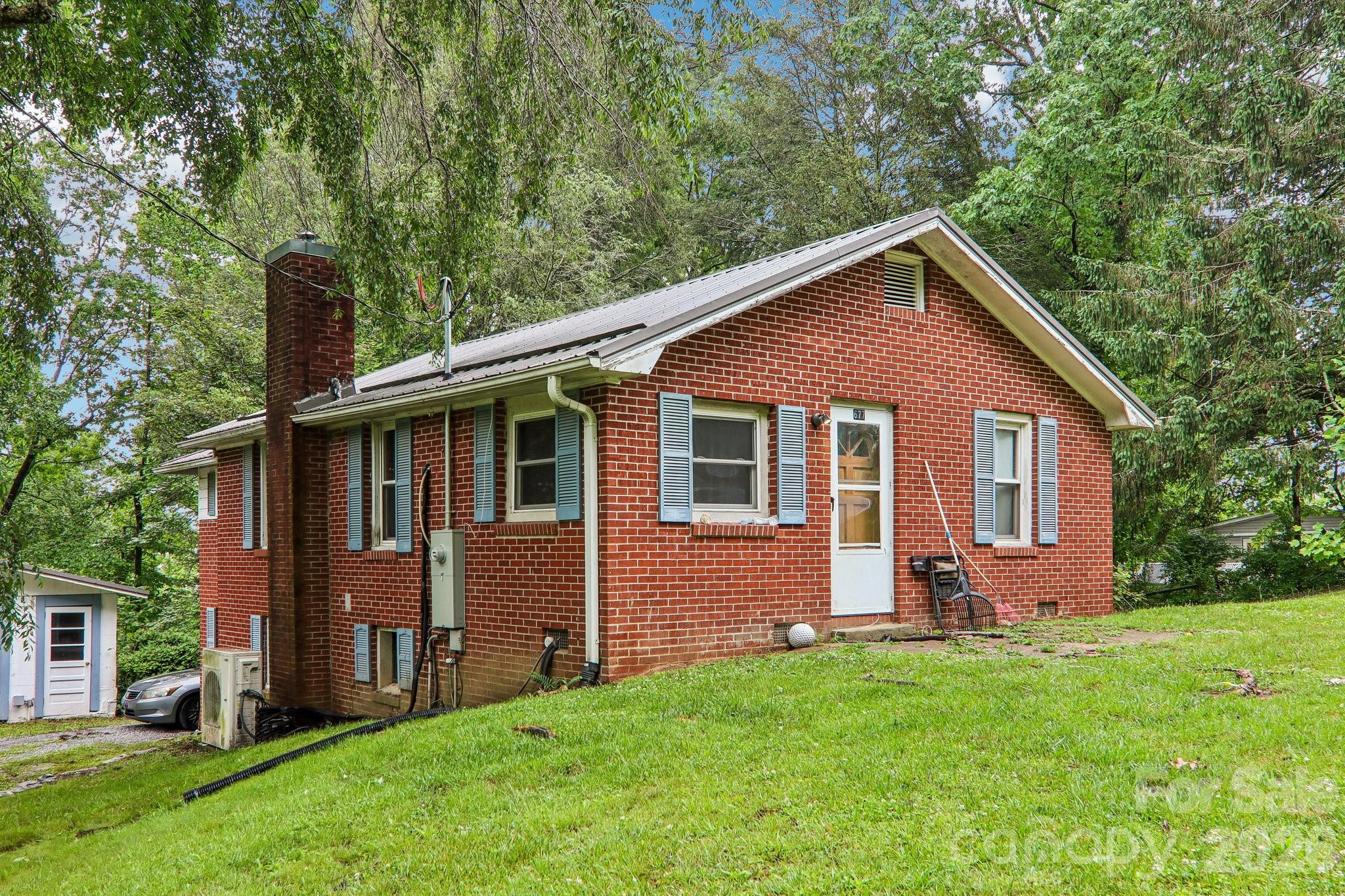 Rental Income potential with tenant already in place! Solid, well built and recently updated brick home in Zirconia! 3 Bedroom, 2 Bath with Vinyl flooring through-out the main level. Basement is finished with a ceiling height less than 7'(not included in the heated sq ft), including a kitchen, dining room, bonus room and large utility room. Updates include Mini Split that's less than 4 years old, vinyl plank flooring, recessed lighting and a metal roof! Conveniently located minutes from downtown Hendersonville and Greenville SC.