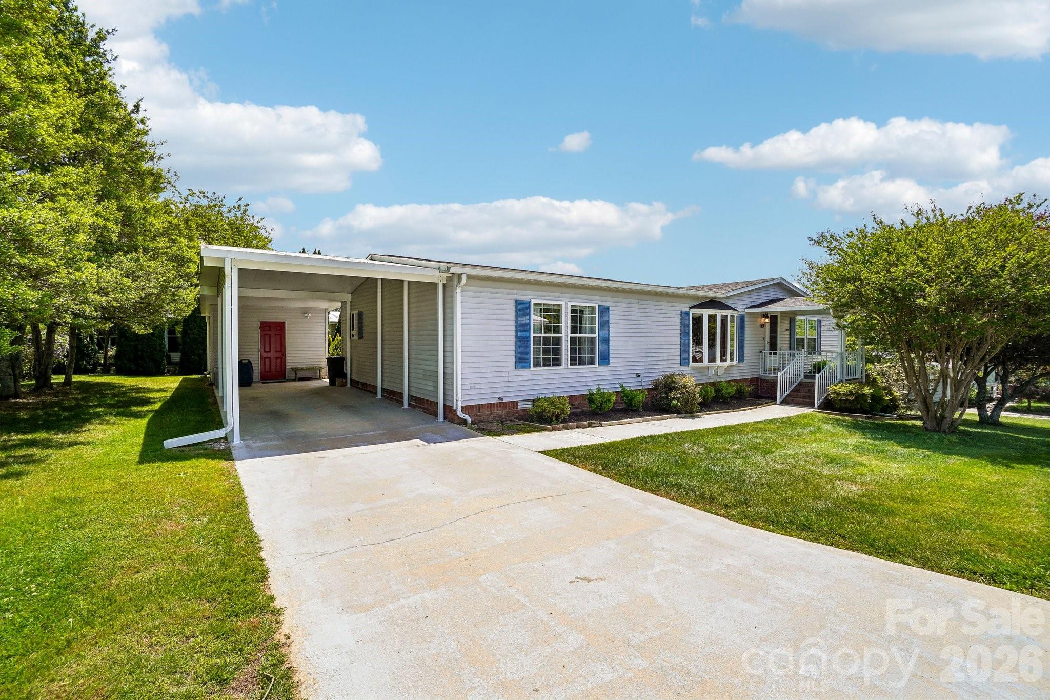 Established and well located 55+ White Oak Village neighborhood. Offers 3 bedroom split plan, spacious kitchen w/dining area, living room, enclosed sunroom (heated by EBB, not included in s.f.). New roof 2025, new heat pump 2024.  One car carport and storage room. One level living and only minutes to downtown Hendersonville!