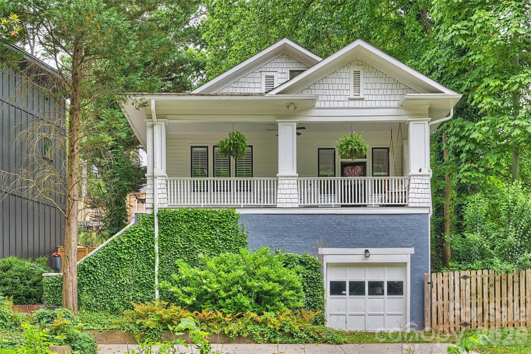 Welcome To The Kind Of Home That Makes People Fall In Love With Plaza Midwood. This Darling 1931 Craftsman Bungalow Is Full Of Warmth, Character, And Timeless Charm, Nestled On A Picturesque Street Where Front Porches Still Matter And Neighbors Wave As They Pass By. The Inviting Rocking Chair Front Porch Feels Straight Out Of A Storybook And Is The Perfect Place For Slow Mornings, Evening Chats, And Soaking In The Charm Of Tippah Avenue. Inside, Classic Bungalow Character Meets Thoughtful Updates. Sunlight Pours Through The Home, While The Beautifully Refreshed Kitchen Adds A Bright And Cheerful Touch With Crisp White Cabinetry And An Airy Feel That Blends Seamlessly With The Home’s Original Soul. Out Back Is Where This Home Becomes Truly Special. Surrounded By Lush Trees And Natural Greenery, The Backyard Feels Like Your Own Hidden Retreat—Peaceful, Private, And Wonderfully Low Maintenance. It’s The Kind Of Space That Invites Quiet Mornings, Garden Dinners, And Afternoons Spent Unwinding In Total Privacy. The Spacious Basement Offers Plenty Of Additional Storage Space Too! And When You’re Ready To Step Out, Plaza Midwood’s Favorite Restaurants, Coffee Shops, Breweries, And Local Spots Are Just Moments Away. Sweet, Charming, And Full Of Heart, This Is The Bungalow Buyers Dream About.