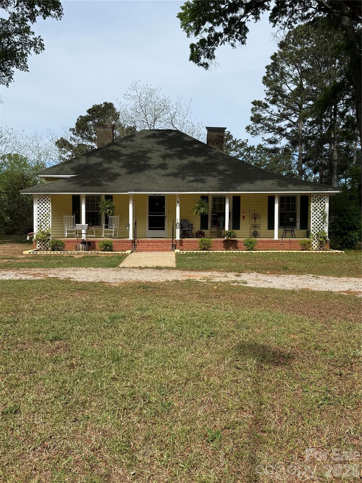 Welcome to peaceful country living in Blackstock, SC! Situated on 2.02 acres, this property offers the perfect blend of space, privacy, and versatility. Whether you’re looking to enjoy quiet rural living, start a small farm, or have room for recreational use, this land provides endless opportunities.

The home features 3 bedrooms and 1.5 bathrooms, with added flexibility—the existing laundry/utility room can be converted to add a second full bathroom, with plumbing already in place. The space can also be reverted back to a dedicated laundry room with hookups available, allowing you to customize it to fit your needs. Both areas can be restored to the home’s original layout if desired. Enjoy relaxing mornings and evenings on the covered front and back porches, perfect for taking in the natural surroundings.

This property is equipped with both electric and gas hookup options, giving you flexibility to suit your needs. Camper hookups are already installed, including a 30-amp RV hookup, making it ideal for RV use or additional living arrangements.

Recent updates including a new drain field that has been pumped, a new hot water heater, updated plumbing, and new breaker panels installed both inside and out. The detached building is wired for lighting, offering a great setup for a workshop, storage, or hobby space.

A tower located out front allows for Starlink internet, with the option to choose Spectrum fiber as well—giving you reliable connectivity while enjoying country living.

The property also features a convenient horseshoe driveway, providing easy access in and out while offering ample parking space for multiple vehicles, trailers, or equipment. The layout of the land allows for added usability, whether you’re looking to expand, garden, or create your own outdoor retreat. With open space and room to roam, this property is ideal for those who value privacy and flexibility.

There is plenty of potential to further enhance the property to fit your lifestyle. Whether you envision adding additional outdoor structures, creating a workshop area, or simply enjoying the wide-open space, the possibilities here are endless. The acreage provides a peaceful setting while still offering functional land use.

If you’re looking for a property with land, functionality, and room to grow, this is a must-see. Experience the charm and freedom of country living while still being within a convenient distance to nearby towns and amenities.

Sellers are very motivated and is offering a buyers concessions with acceptable offer. Contact listing agent for more detail if not an agent... all agents see agents remarks!