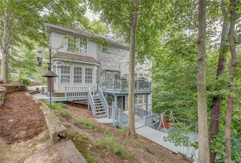 Beautiful home in desirable Timberlake! Home feels like a treehouse retreat with view of the water. Basement is spacious and has access to walk out to the boardwalk. Setting is unmatched! 2 story entry, great room open to dining. Kitchen with granite counters and breakfast area overlooking deck, perfect for entertaining. Master bedroom is flooded with light, so many windows! Separate tub shower. Close to downtown Belmont and Cramerton, both are golf cart towns!