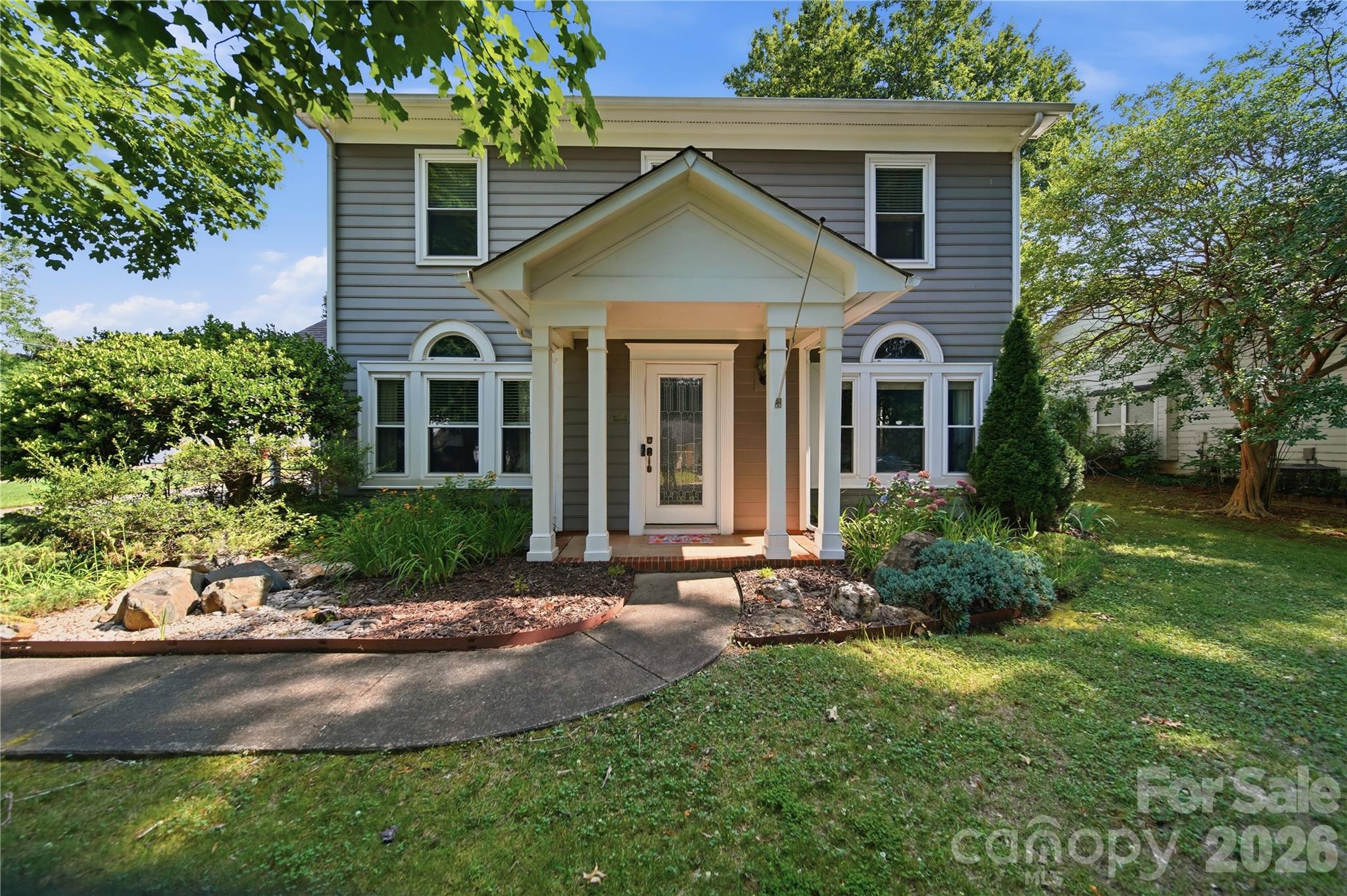 This charming 4-bedroom, 2.5-bath home offers a spacious and versatile layout. The main level features a living room with elegant French doors, a formal dining room, and a great room that flows seamlessly from the kitchen and breakfast area. A convenient main-level laundry adds everyday ease.

Outside, enjoy a private fenced backyard with a covered patio—perfect for outdoor entertaining. The detached two-car garage includes a walk-up attic for additional storage, and a smaller storage/gardening shed provides even more space for tools and hobbies. 

Updates and Improvements:

Full roof replacement on the house and detached garage in 2021,
Patio slab and covered pavilion added in 2019,
Retaining wall installed in 2019,
New AC and furnace in 2019,
New water heater in 2018,
New wood-burning fireplace insert with new pipe up the chimney in 2020
Gutter guards installed in 2017 and
All exterior trim and doors painted in 2022