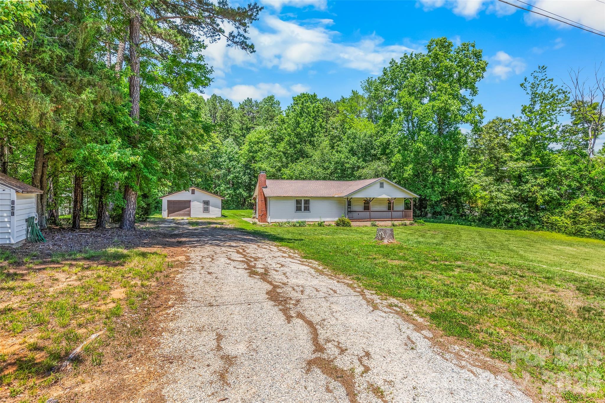 ONLINE ONLY AUCTION. LIST PRICE IS NOT SELLER'S ASKING PRICE BUT TAX VALUE OR CURRENT HIGH BID PLUS BUYER'S PREMIUM. Discover peaceful country living at 141 Winged Elm Lane in Mooresville. Situated on 1.04± acres, this ranch-style home offers approximately 1,378± square feet with 3 bedrooms and 2 full bathrooms. The home features a spacious living room, dining area, functional kitchen, covered front porch, and covered rear deck overlooking the private setting. A detached garage/workshop of approximately 774± square feet provides excellent space for vehicles, hobbies, storage, or equipment. Conveniently located near shopping, dining, schools, and recreation while offering the privacy of a country setting. Ideal for homeowners, investors, or those seeking extra space. Bid your price and don't miss this opportunity!