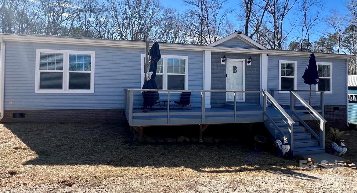 Here is your chance to own a nice quiet piece of the country! This beautiful 3/2 on 3.3 acres in a peaceful setting provides a little piece of the country but just 10 min to restaurants and shopping! The 5 year old home features a nice big kitchen island with an open floor plan and 3 spacious bedrooms! Home has a nice built in desk in the hallway and large mudroom with a sink and a drop zone!  Outside is an 18' x 30' partially enclosed building that has a carport and electricity.  Fenced back yard, owner currently has chickens and a goat and the chicken coop will stay.  Property looks out over a pond across the street. Septic and Well were just installed on the property in 2019.  Seller is giving a 1 year warranty with home. Home is USDA eligible!