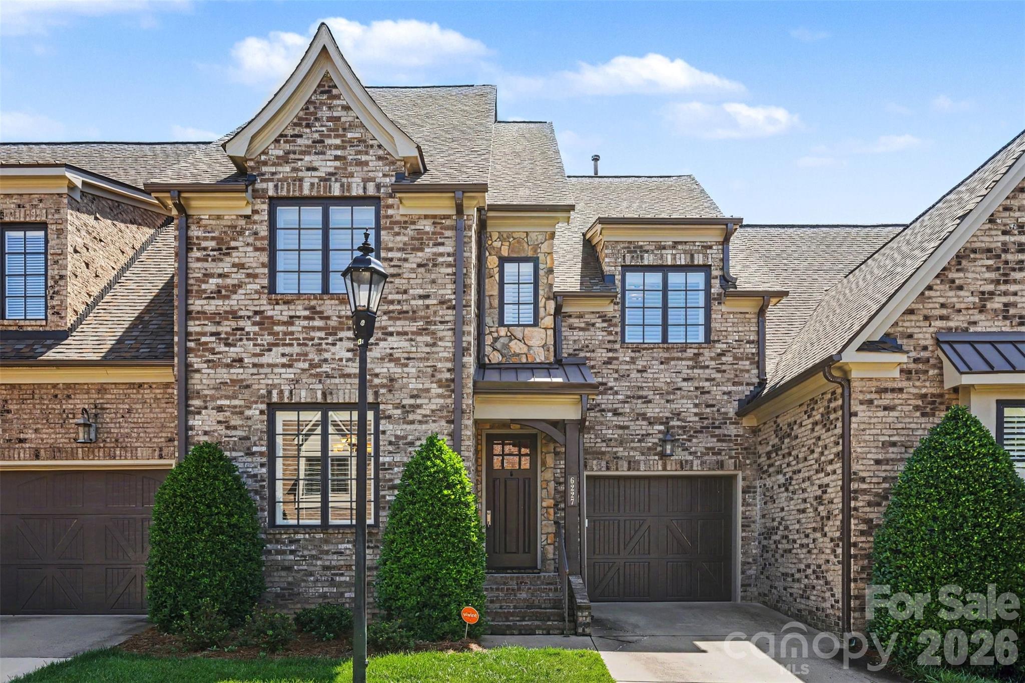 Lovely English manor inspired townhome in one of South Charlotte’s highly coveted private gated communities.
The Mayfair features a quiet, peaceful lifestyle just a short drive to South Park and Ballantyne area shopping and restaurants including the new Ballantyne Bowl as well as Waverley. Enjoy easy access to highways. This townhome has beautiful recent upgrades to kitchen and baths. Custom plantation shutters, and newly refinished on site hardwoods as well as new neutral paint throughout the home. The private backyard features a custom outdoor fireplace for entertaining with a large paver patio and ample green space. The patio furniture, garden umbrella and gas grill (represented as is) to convey with sale of home. Don’t miss this rare opportunity to own in The Mayfair!