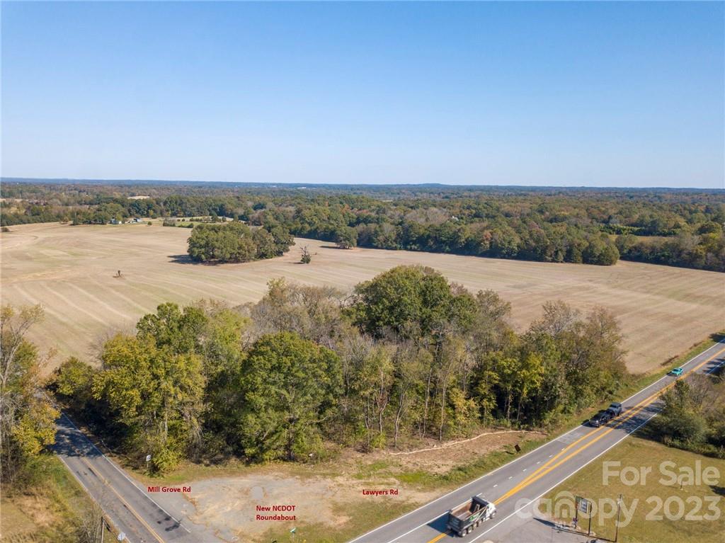 Unlimited Possibilities - Opportunity to purchase a seldom found large track at the corner of Lawyers and Mill Grove Rd. Surveyed  68.97 acre parcel #08-315-010. Corner of Lawyers and Mill Grove zoned B4. Over 3000 feet of road frontage. County water and natural gas lines are on both roads. Construction of NCDOT roundabout at intersection should begin soon. Within 5 minutes of 4 golf courses and 2.2 miles from I485. Please do not walk land without scheduling appointment through listing agent.