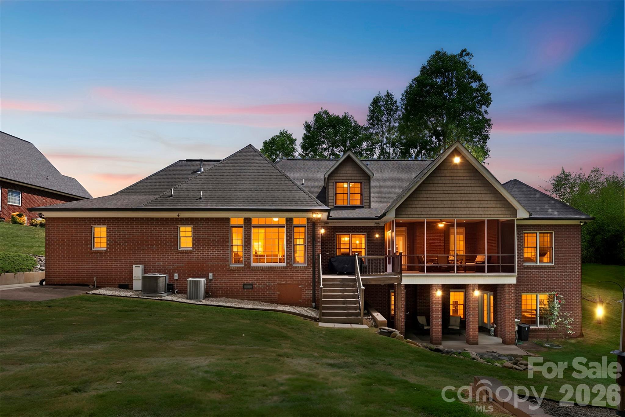 Stunning Six-Bedroom Custom Home with a Fully Finished Basement Suite on 1.41 Private Acres in Cramer Woods – Loaded with Upgrades and surrounded by top-notch schools!

This exceptional custom home offers the perfect blend of luxury, function, and space. Soaring ceilings, detailed moldings, and an open-concept layout create an inviting main living area, anchored by a dual-sided fireplace that seamlessly connects indoor and outdoor living—perfect for relaxing, birdwatching, or enjoying the peaceful sounds of the in-ground koi pond waterfall.

The stunning kitchen is a true showpiece, featuring granite countertops, double wall ovens, a pot filler, an oversized island with a breakfast bar, a built-in desk, and an expansive walk-in pantry with abundant cabinetry and storage.

The main level includes two secondary bedrooms and a full bath, along with a spacious primary suite showcasing a lighted tray ceiling and large windows. The fully renovated primary bathroom is a true retreat, highlighted by a rare double-sided freestanding soaking tub, a glass-enclosed shower, dual vanities, and a generous walk-in closet.

Upstairs offers additional bedrooms/bonus space and a full bath, along with custom built-ins, wide hallways, window seating, and endless storage throughout.

The fully equipped second living quarters are ideal for multi-generational living or guests, featuring a full kitchen with granite countertops and tile backsplash, a dining area, a living room with a fireplace, a bedroom, a full bath with a double vanity, an oversized closet, an additional half bath, and a covered patio.

Additional features include a safe room, tankless water heater, and a double garage with built-in cabinetry and a workbench.

All of this sits on a beautifully landscaped 1.41-acre private lot complete with a fire pit, mature trees, and vibrant flowers—your own personal retreat. And the back yard is perfectly blank canvas for your dream pool!

Tavel for work or for fun often? Just 12 miles or 20 minutes to Charlotte Airport!