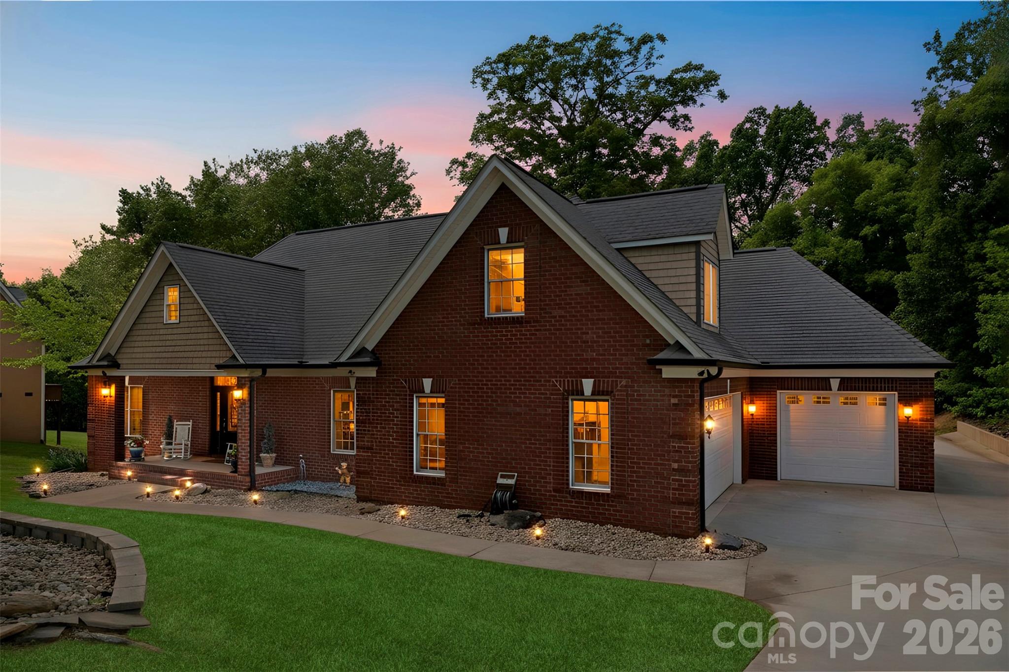 Stunning Six-Bedroom Custom Home with a Fully Finished Basement Suite on 1.41 Private Acres in Cramer Woods – Loaded with Upgrades and surrounded by top-notch schools!

This exceptional custom home offers the perfect blend of luxury, function, and space. Soaring ceilings, detailed moldings, and an open-concept layout create an inviting main living area, anchored by a dual-sided fireplace that seamlessly connects indoor and outdoor living—perfect for relaxing, birdwatching, or enjoying the peaceful sounds of the in-ground koi pond waterfall.

The stunning kitchen is a true showpiece, featuring granite countertops, double wall ovens, a pot filler, an oversized island with a breakfast bar, a built-in desk, and an expansive walk-in pantry with abundant cabinetry and storage.

The main level includes two secondary bedrooms and a full bath, along with a spacious primary suite showcasing a lighted tray ceiling and large windows. The fully renovated primary bathroom is a true retreat, highlighted by a rare double-sided freestanding soaking tub, a glass-enclosed shower, dual vanities, and a generous walk-in closet.

Upstairs offers additional bedrooms/bonus space and a full bath, along with custom built-ins, wide hallways, window seating, and endless storage throughout.

The fully equipped second living quarters are ideal for multi-generational living or guests, featuring a full kitchen with granite countertops and tile backsplash, a dining area, a living room with a fireplace, a bedroom, a full bath with a double vanity, an oversized closet, an additional half bath, and a covered patio.

Additional features include a safe room, tankless water heater, and a double garage with built-in cabinetry and a workbench.

All of this sits on a beautifully landscaped 1.41-acre private lot complete with a fire pit, mature trees, and vibrant flowers—your own personal retreat. And the back yard is perfectly blank canvas for your dream pool!

Tavel for work or for fun often? Just 12 miles or 20 minutes to Charlotte Airport!
