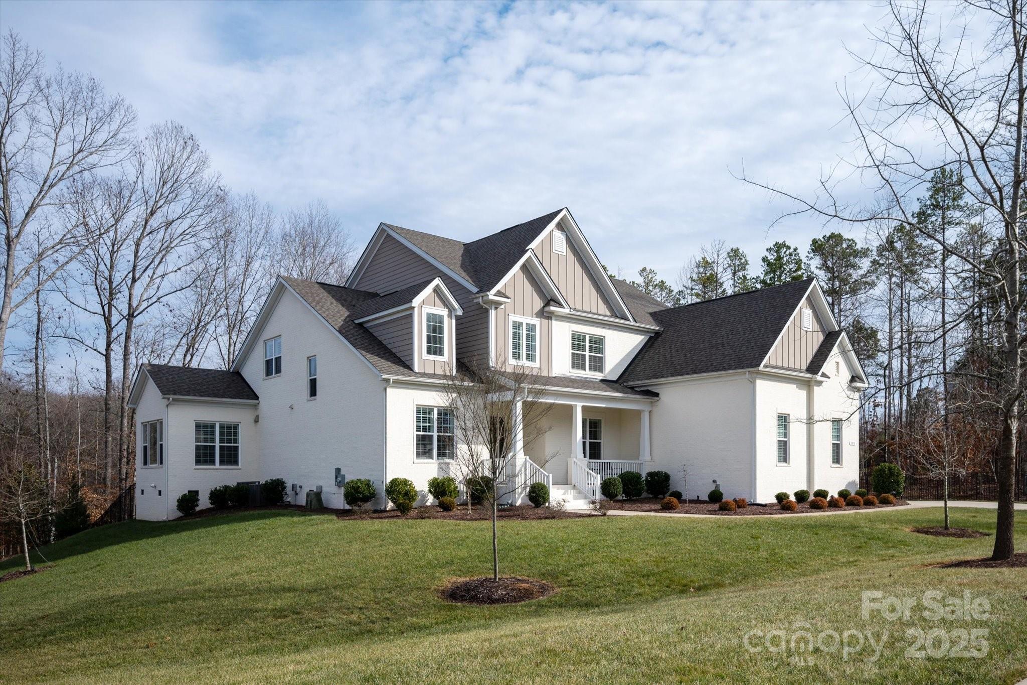 Stunning, move-in ready home in the desirable Marvin Ridge School district. Beautiful wide plank floors throughout first floor, stairs and upper hallway. Chef's kitchen with custom white cabinetry, marble countertops, stainless steel appliances, wine refrigerator, walk-in pantry, pot filler, island w/ seating & ceramic apron sink. Spacious great room with custom built-ins and gas fireplace. First floor office w/french doors, lots of light..just off the kitchen. Primary down suite with views of the wooded and private backyard. Spa-like primary bath w/ seamless shower, soaking tub, quartz counters, large walk-in closet and secondary laundry. Second floor has 3 additional bedrooms, 1 with a dedicated bathroom, primary laundry & two bonus rooms..1 of which can be a 5th bedroom. Huge walk-in storage off bedroom three. Private acre lot that has been professionally landscaped with firepit, covered porch, full irrigation and fence. Plantation shutters throughout. Award winning Marvin Schools!