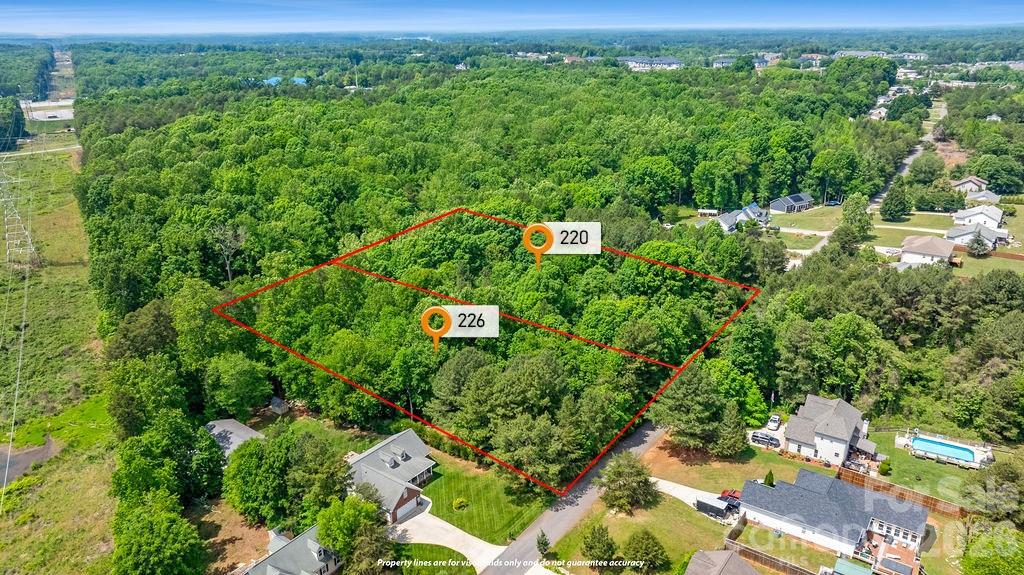 Tucked among mature trees in a prime Mooresville location, this 1.30-acre homesite offers the ideal setting for your custom dream home. Lots 20 & 21 are being sold together, providing ample space, privacy, and flexibility while remaining just minutes from shopping, dining, and convenient highway access. Situated within the highly sought-after Lake Norman school district, this is a rare chance to secure a beautiful wooded property and bring your own builder. Expired 3-bedroom septic permit on file. Lots will not be separated.