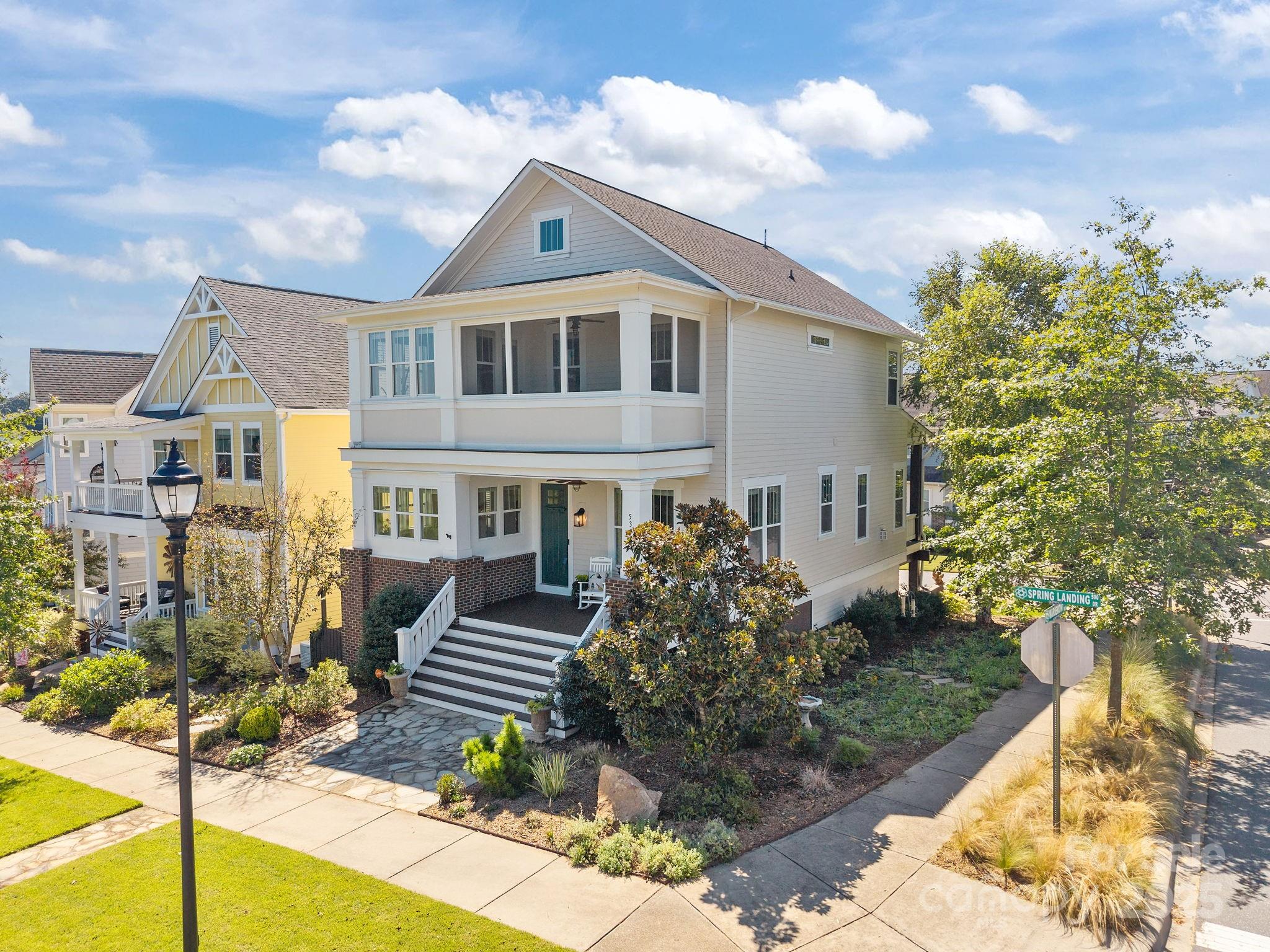 This southern daydream greets you not as a house, but a gracious host. Freshly painted in soft Southern hues, it stands on a corner lot, framed by manicured gardens that whisper of afternoon tea and porch-lined conversations.Stepping across the covered front porch, your shoes meet solid hardwood floors that stretch graciously into an open floor plan—every plank echoing the laughter you’ll share here. The ceilings hover at a lofty 10 feet, held aloft by elegant oversized baseboards and grand 8-foot doors—a subtle reminder that beauty lies in the details. The gourmet kitchen is not merely a place to cook—it is the appointed stage for culinary dramas. A commanding kitchen island, a gas range, self-cleaning oven, and a pantry prepped for fine wines or a midnight snack all await the host with impeccable taste. Imagine retiring to the main-level primary suite, where creature comforts meet refined design: sumptuous spaces opening onto your private porch, and a spa-inspired ensuite bath. Oversized tiled shower, dual-sink vanity, and a discreet water closet invite mornings with ritual and evenings with indulgence.Climb the staircase and discover a loft drenched in natural light—the perfect perch for quiet reflection. From here, the screened-in sleeper porch beckons. It’s a twilight realm where summer breezes lull you to slumber under a blanket of stars. Four bedrooms in total—three upstairs and one downstairs—provide room enough for family, guests, or an impromptu writer-in-residence. With 3.5 baths, each member of the household has a spa-worthy morning of their own. For those who adore open space and Southern charm, three porches—a front, rear, and screened sanctuary—offer vistas of the Riverwalk community. Practicality dances with elegance here: an oversized two-car garage with extra storage, a mudroom, and clever crawl space access complete with a dehumidifier.  Built in 2014 by Saussy Burbank, this home is not new; its lovingly kept, prideful, and infused with an enduring charm typical of the finest Southern host. Amenities include short walking distance to shops/restaurants along the riverfront, neighborhood pool, walking trails along the river and multiple recreation areas, all under the watchful gaze of a vibrant community. Not only a must-see, but a must-experience.