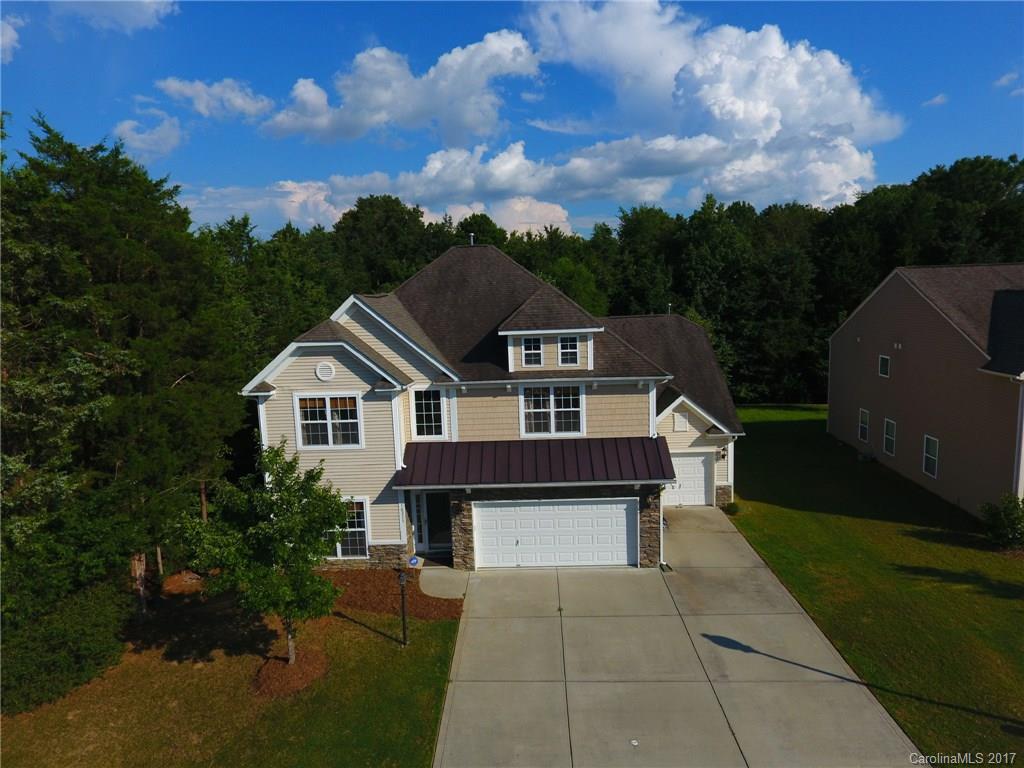 Check out this beautiful, spacious home in the sought after subdivision of Waterlyn in the Steele Creek area! Home features 5 beds, 3 full baths, 3-car garage, large kitchen with granite counters, screened in porch, 6' tall privacy fence, tankless water heater and a whole home filtration system! In-law suite on main floor and over-sized owners suite upstairs with a huge master bath featuring separate shower and garden tub. Community features walking trails, pond, community pool and clubhouse!