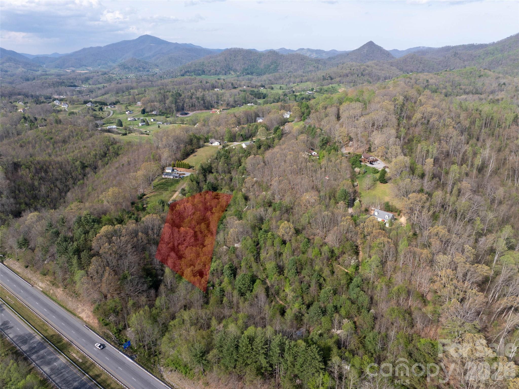 Discover the perfect mountain retreat with this beautiful 1.98-acre home site located in the desirable Hyder Mountain Acres subdivision, nestled in the heart of Haywood County and the scenic Blue Ridge Mountains. With selective trimming, the property boasts stunning panoramic views—ideal for enjoying the peaceful mountain setting. Conveniently located near I-40, this lot provides quick access to Asheville, Tennessee, and all that Haywood County has to offer. The subdivision requires only a 1,000-sqft min build, offering great flexibility for your home design, manufactured not allowed.