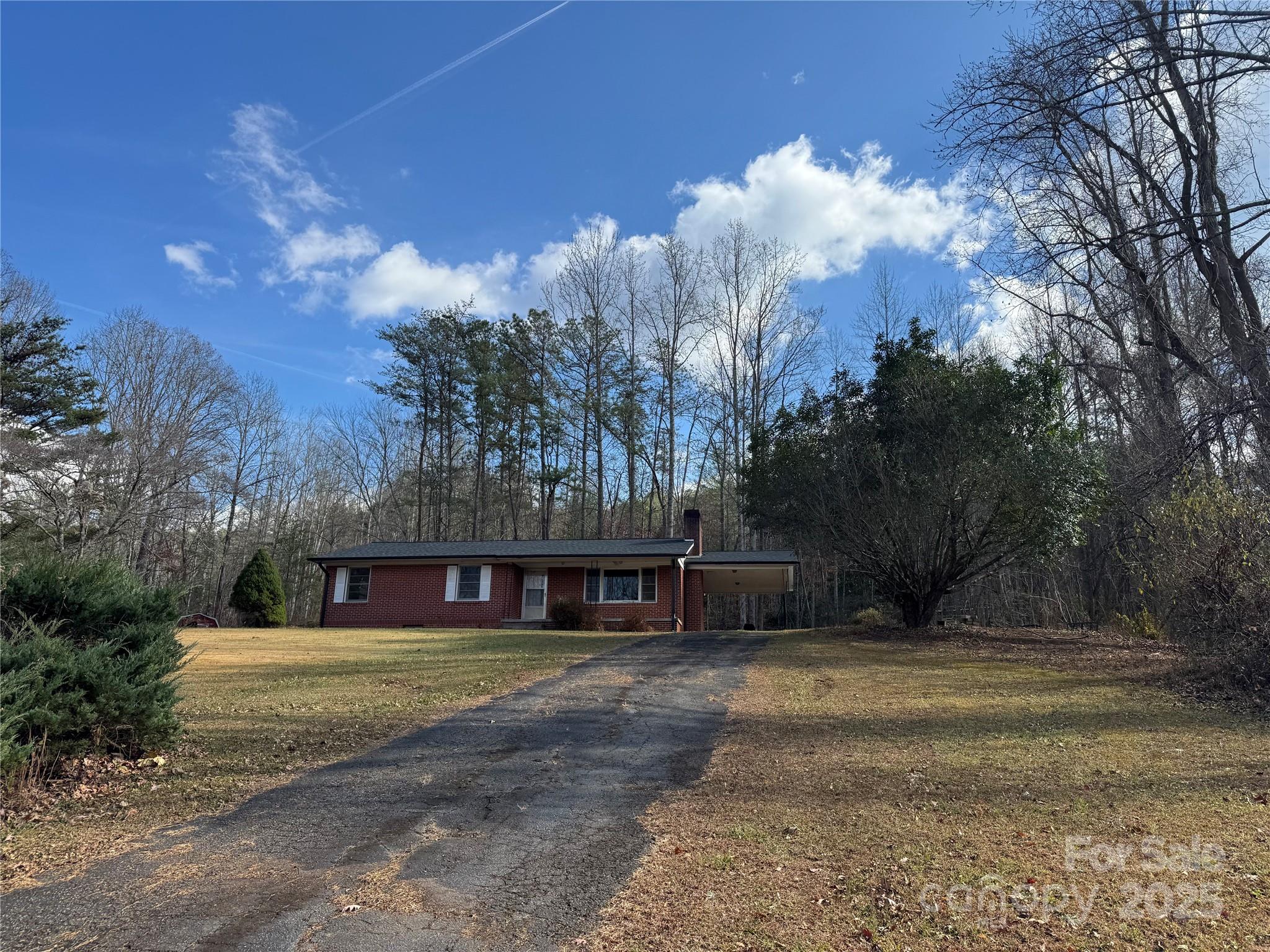 Discover all the potential that this brick home has to offer, nestled on 8.02 acres of unrestricted beautiful land. Offers some long range views. Featuring 3 bedrooms, 1 bathroom, and a basement for extra storage, this property offers plenty of space to make your own. The spacious kitchen provides an excellent layout for entertaining or everyday living, while the attached carport adds convenience and functionality. Whether you’re looking for your next investment, a peaceful country retreat, or a property with room to expand, this home offers endless possibilities. With its combination of acreage, privacy, and potential, this one is full of opportunity! Cash only