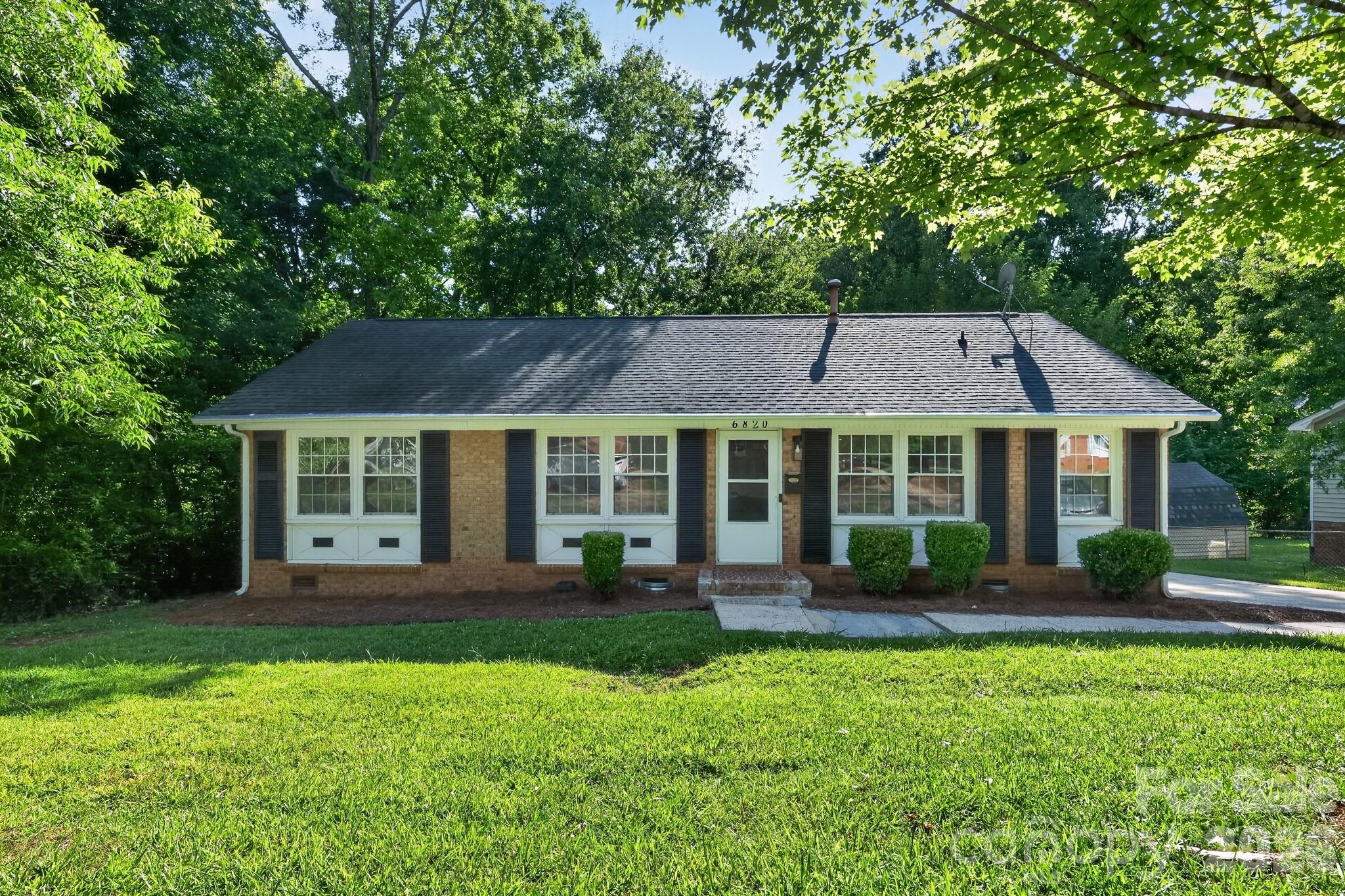 This thoughtfully refreshed 3-bedroom, 2-bath Charlotte home delivers real move-in value, highlighted by a transformed kitchen with crisp white cabinetry, new quartz countertops, a new undermount sink, matte black pull-out faucet, and a brand-new stainless steel appliance package, along with new luxury vinyl plank flooring, fresh bedroom carpet, fresh neutral paint, and updated lighting throughout. Together delivering comfort, confidence, and lasting value to its next owner.