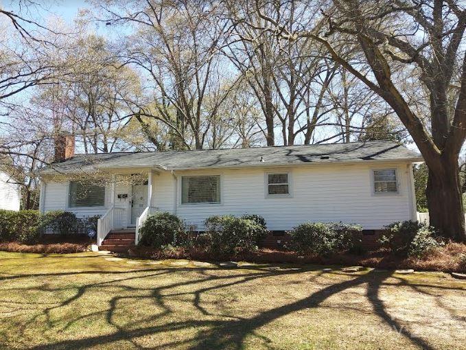 Charming home located in the heart of Lancaster, has three bedrooms, two baths. This property has convenient access to the city of Lancaster, just 1 mile to Main Street and 1 minute to MUSC. Hardwood floors have recently been refinished. Classic knotty pine paneling gives this home a warm feeling with abundant natural light. Large kitchen has breakfast area with open plan to family room. All appliances to remain. Formal living room has a fireplace. Custom deck allows views of the beautiful, large back yard with many lovely plantings. New roof. This affordable home is in a central location in Lancaster.