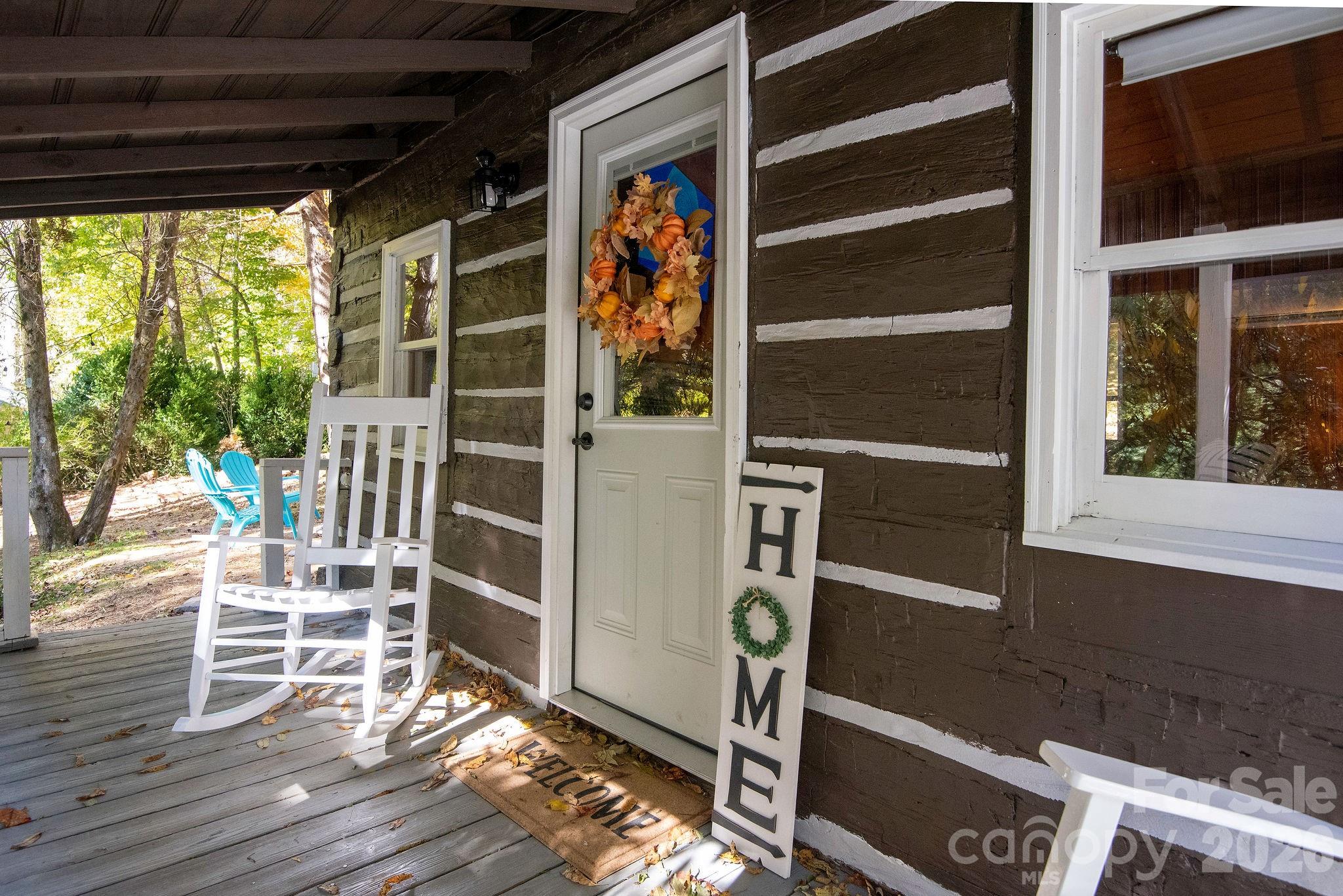 Classic cabin character, modern updates, and a proven rental history make this one stand out from the crowd. Full of rustic charm but thoughtfully updated throughout, this classic log cabin offers the character of an old mountain retreat without sacrificing comfort. Vaulted ceilings, a wood-burning fireplace, warm wood finishes, and carefully curated furnishings create a cozy atmosphere that feels like the mountains should. Despite its compact footprint, the cabin comfortably sleeps four and has earned rave reviews from guests. Tucked into a peaceful wooded setting just 10 minutes from both Appalachian State University and downtown Boone, it offers the privacy visitors want while remaining close to dining, shopping, hiking, and year-round attractions. Outside, guests can unwind in the hot tub, gather around the fire pit, and enjoy the quiet surroundings that make the High Country such a sought-after destination. The cabin has a proven track record as a successful short-term rental, generating $35-$45k in annual gross income annually over the last 2 years. Even better, it is being offered fully furnished down to the linens and decor, making it a truly turnkey investment or personal getaway. Whether you’re searching for a personal retreat, a turnkey rental, or a little bit of both, this cabin is ready to enjoy from day one.