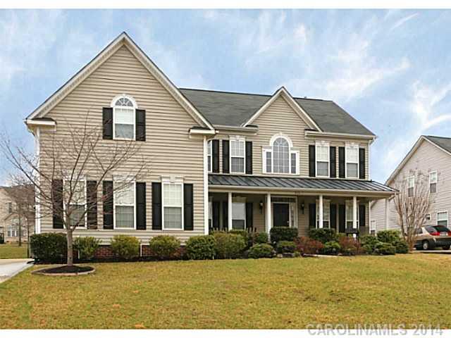Gorgeous Brazilian cherry hardwood floors,2-story great room,and cook's "dream kitchen" distinguish this Fort Mill home.You'll love the location for easy access to I-77 for a convenient commute to uptown.Easy flowing floorplan with main floor office(or guest room),formal living & dining. Curl up with a book in the sunroom, overlooking fenced garden with deck & stone patio.3 Car Garage.See tour!