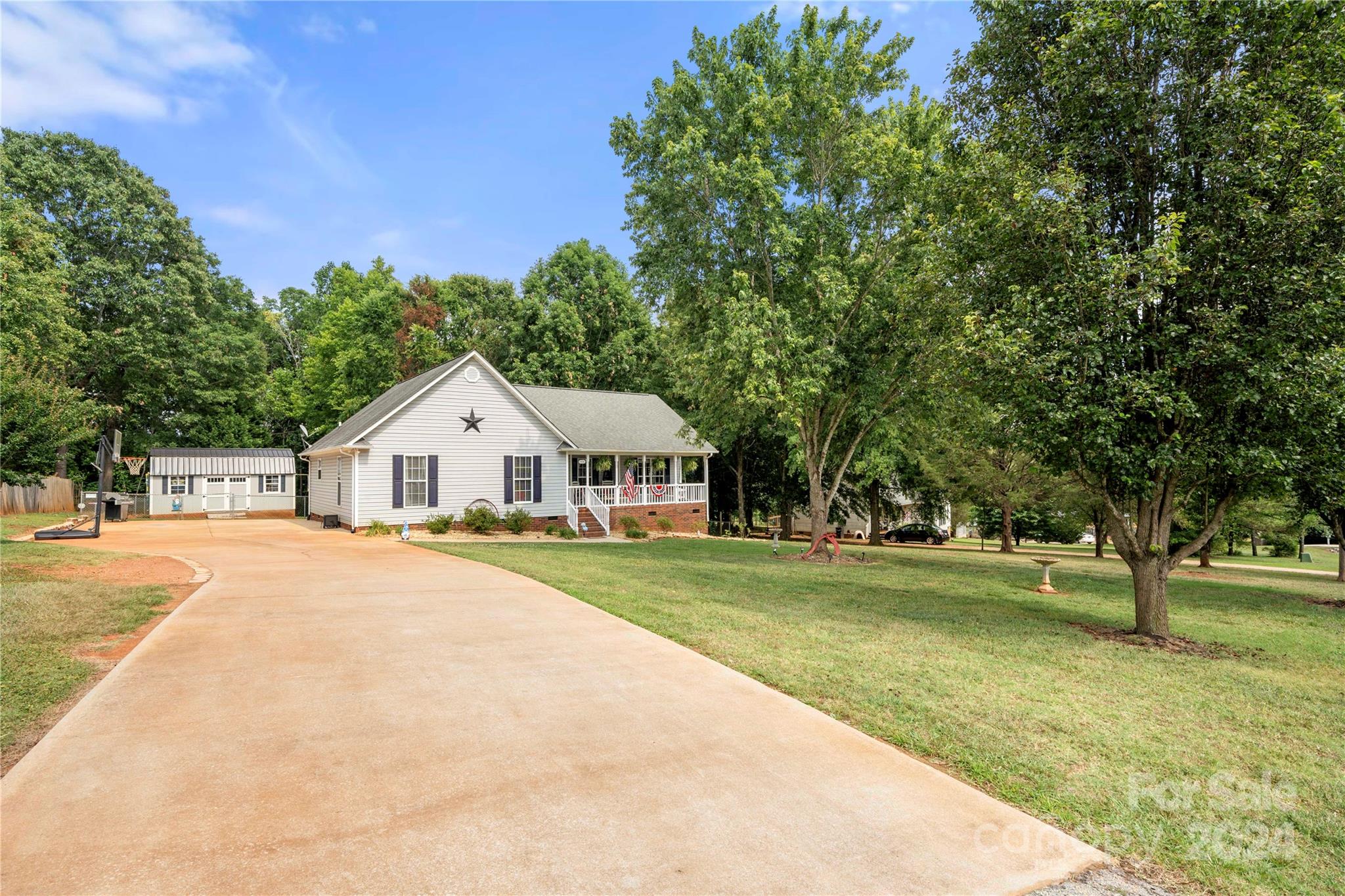 Move in ready ranch style home on 1 acre complete with rocking chair front porch and fenced rear yard. Sip sweet tea or your beverage of choice and enjoy the peace and quiet in this beautiful farmhouse style home.  Three bedroom,2 bath home  is as cute as it can be.  Large front and back yard (plenty of room for a garden).  Two outbuildings remain with the property.  Updated kitchen with newer appliances.  Newer vinyl flooring everywhere except one bedroom which has new carpet. Make an appointment to see this one today.  You won't be disappointed.
Fireplace sold as is - seller has never used