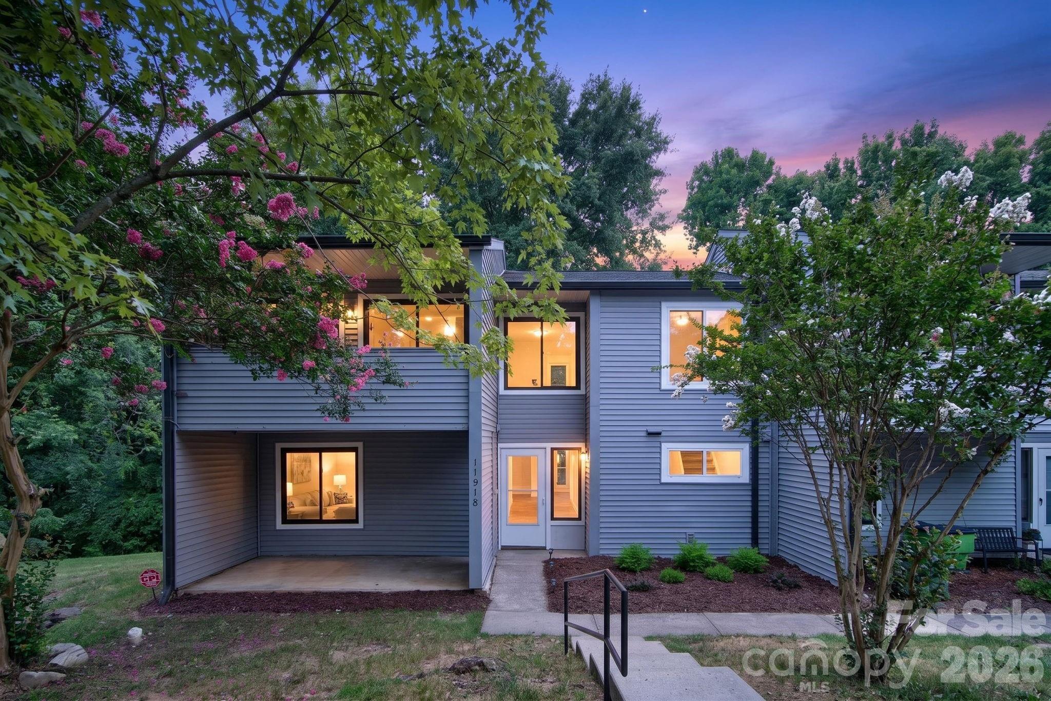 Completely updated from top to bottom, this stunning end-unit with a covered balcony and covered patio area is located in one of South Charlotte's most desirable areas, just a short walk to the greenway, grocery stores, restaurants, and everyday conveniences. The community is undergoing exciting improvements, including a new clubhouse, pool, and additional phase with new townhomes making this an incredible opportunity to own at an exceptional value.

Inside, you'll find a bright, open floor plan featuring a two-story great room with vaulted ceilings and a cozy fireplace. The spacious all-season porch with skylights overlooks a private setting, creating the perfect space to relax year-round. Nearly every surface has been updated, including luxury flooring, a beautifully remodeled kitchen, bathrooms, interior doors, hardware, light fixtures, ceiling fans, carpet, and an upgraded electrical panel. You'll be hard-pressed to find anything left to do. A 2021 Trane HVAC system provides added peace of mind, and the new refrigerator, new stackable washer and dryer convey with the home.

Offering 4 bedrooms and 2.5 beautifully updated baths, this home combines style, space, and functionality. The HOA covers exterior maintenance, water, and lawn care providing the low-maintenance lifestyle that's increasingly difficult to find in this highly sought-after location. Convenient to Ballantyne Bowl and all Ballantyne has to offer, shopping, dining, and major roadways, this move-in-ready home is one you won't want to miss.