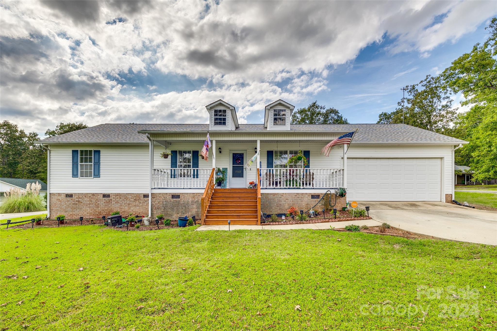 This charming, well-maintained three-bedroom, two-bath home offers the perfect blend of comfort and convenience. The spacious living room and kitchen, complete with built-ins, flow seamlessly into a cozy dining area, ideal for family meals. Step outside to a beautiful, freshly painted back deck, where you’ll find three elegant gazebos, creating a versatile entertainment space. Enjoy the luxury of a hot tub and an above-ground pool, nestled in a serene, quaint setting that feels like a private retreat. The large covered front porch is perfect for sitting and swinging, where you can unwind and take in the peaceful country surroundings. All this is just minutes from shopping, with a beautifully landscaped yard adding to its charm.