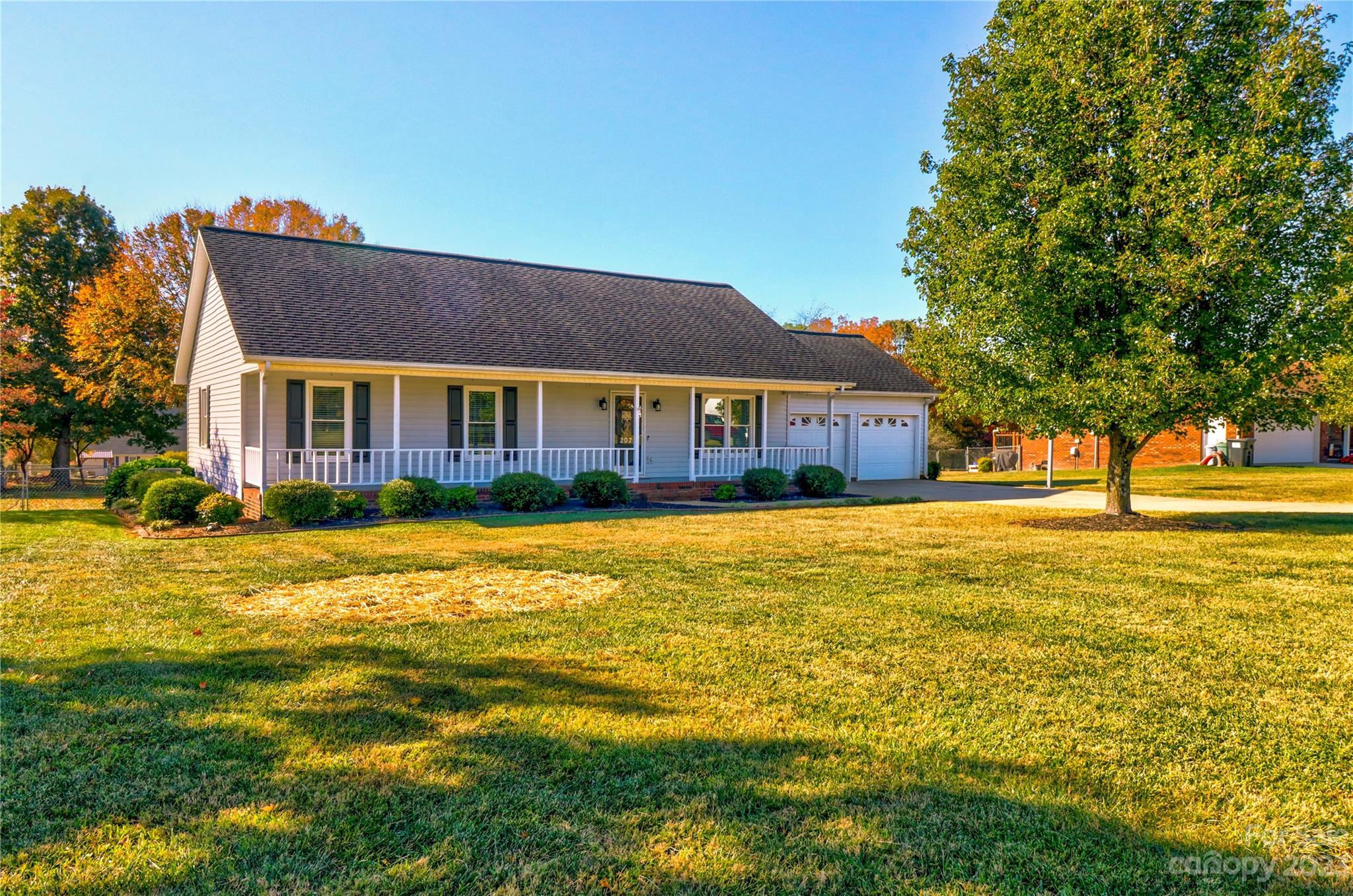 Beautiful Ranch Home with Attached Two Car Garage AND a Detached Two Car Garage or Workshop Building! Fenced Yard is .72 Acre, with lots of space to enjoy! A Must See, this Home has recent Updates that shine: White Kitchen Cabinetry and Marble look Countertops, LVP Flooring throughout the Home, Both Full Bathrooms feature new Vanities with new counter tops, new Fixtures.  Serene Primary Bedroom features a Walk In Closet, and a Ceiling Fan.  Two more Spacious Bedrooms, and a Hall Bath.  This Home wows with an Open and Light Floor Plan.
Dining area and Kitchen overlook the Fenced Back yard. Relax on the Covered Back Porch or Entertain in the Back yard.  Excellent Workshop or great Storage with the Detached 28 x 20 Garage Building. Welcoming Full Covered Front Porch, too! This Home is located just a few minutes from I-40 and Downtown Statesville. Low Iredell County Taxes! Spotless and Ready to make this your New Home!