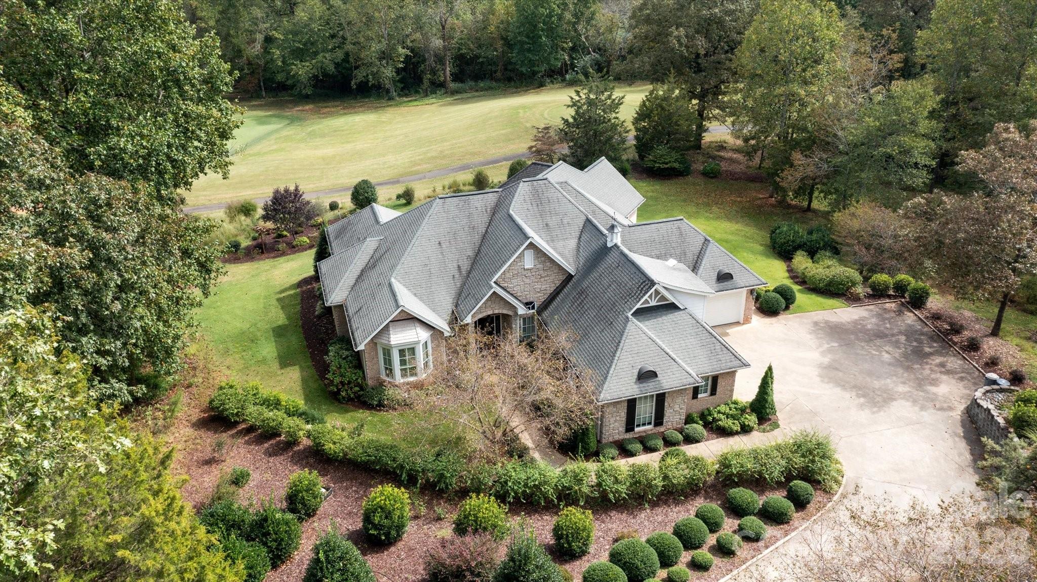 This stunning home overlooks the 17th green at Cleghorn Golf Course and boasts four bedrooms and three bathrooms on the main level.  The premier landscaping and sprawling porches make this property perfect for both entertaining and relaxing.  Cruise right out of your golf cart garage and down the cart path to the sports club with a full service restaurant, 18 hole golf course, swimming pool, and sporting courts.  The interior of this magnificent home includes vaulted and tray ceilings, upscale open kitchen, wood and tile floors, plantation shutters, over-sized dining room, office, walk-in closet, and walk-in open shower.  Plenty of storage in the fully encapsulated crawlspace as well.  Minutes from Rutherfordton, Forest City, Lake Lure, and the Tryon International Equestrian Center.