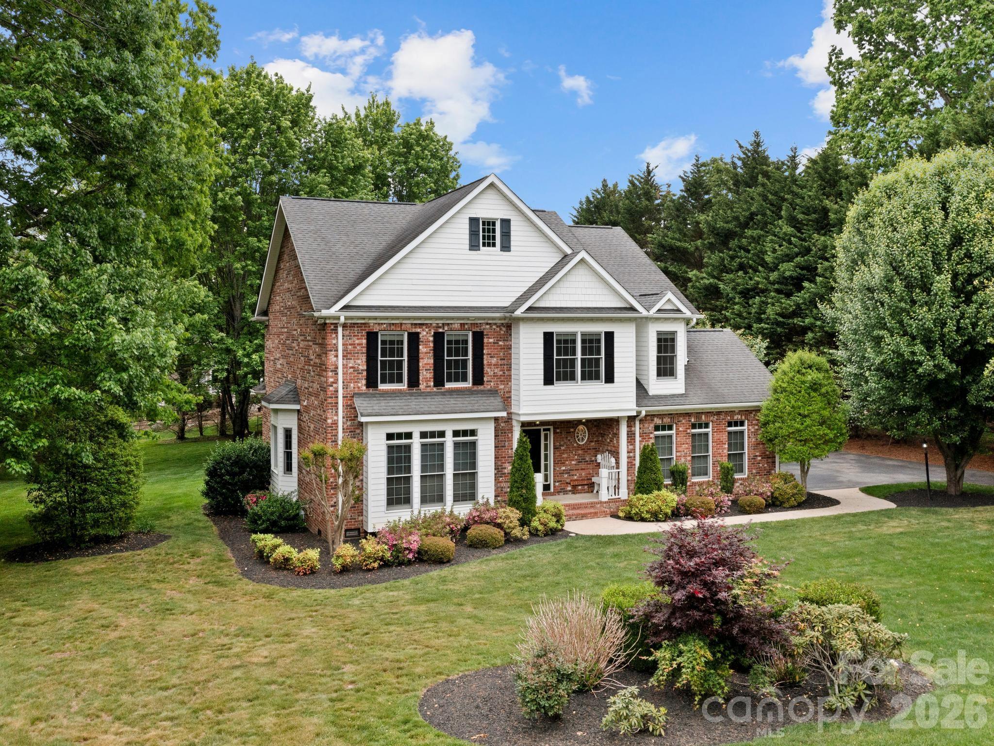 Welcome to 103 Berry Hill Drive an immaculate, move-in ready home nestled in the established Berry Hill neighborhood of Hendersonville. From the moment you arrive, you’ll appreciate the exceptional curb appeal, highlighted by a mostly brick exterior, mature landscaping, & a beautifully manicured, highly usable lot.
Inside, the main level features rich oak flooring & a bright, spacious kitchen complete with an island, ample cabinetry, & seamless flow into both formal & casual dining areas - perfect for everyday living & entertaining. The open floorplan is anchored by a stunning family room with soaring 16-foot cathedral ceilings, creating an inviting & airy atmosphere. A formal sitting room adds additional flexibility for gathering or quiet retreat.
This home offers four generously sized bedrooms, two full bathrooms, & a convenient half bath on the main level. The side-entry two-car garage provides easy access & enhances the home’s clean exterior lines.
A standout feature of this property is the detached guest house/studio - ideal for guests, a private office, or multi-generational living. This versatile space includes a bedroom, full bathroom, dedicated office area, an additional one-car garage, & a large storage room.
With its combination of thoughtful design, flexible living spaces, & pristine condition, 103 Berry Hill Drive is a rare opportunity in one of Hendersonville’s most desirable neighborhoods.