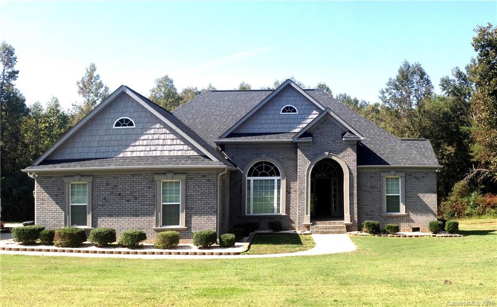 Stunning home on private 3 acre lot on dead end street in rural subdivision. Most homes in neighborhood are 2-5 acre lots. Beautiful mix of grey brick with stucco accents with arched entrance. Interior has hardwood floors, SS appliances soaring ceilings w/ recessed lighting, triple trey ceiling in Master BR. All rooms and closets have heavy 4" crown molding that really gives it a beautiful finished look. Archway entrance door and Arched entrances to Great Room and dining room is very stunning.