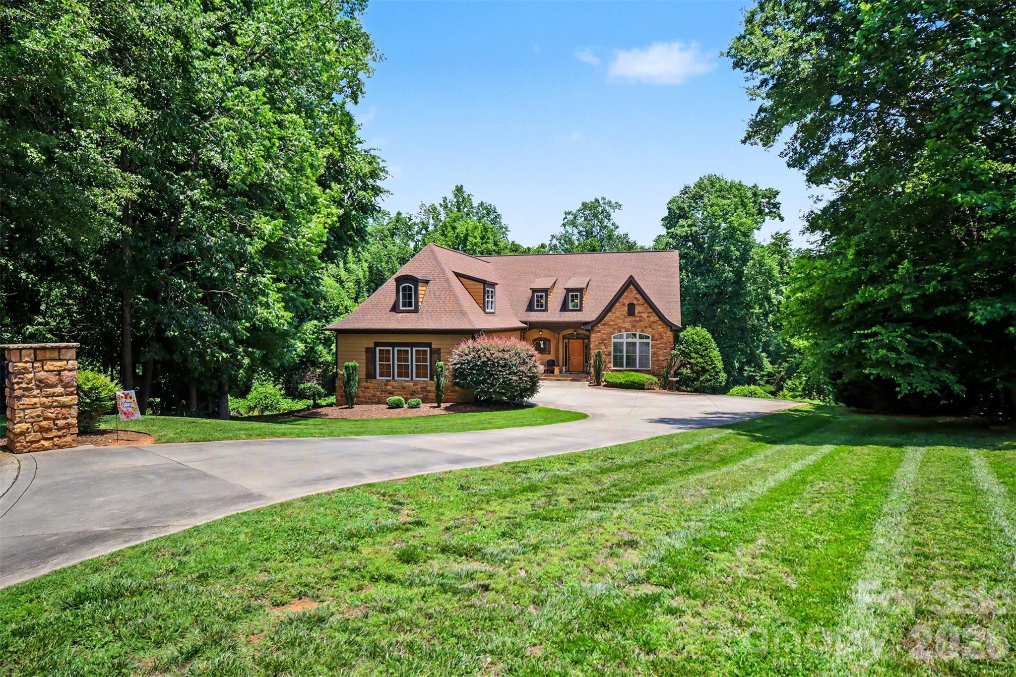 Fabulous SMART CONSTRUCTION home has it all--privacy, desirable floor plan, space for additional bedrooms, cul-de-sac lot, and modern amenities--all in the sought-after Johnsfield neighborhood centrally located in the heart of Shelby.  Enter into a light-filled foyer with cathedral ceilings. To the right, there is a beautiful dining room with coffered ceiling and thick molding accents. A fabulous kitchen is the heart of the home and includes granite countertops, custom cabinetry, 5 burner gas cooktop, double ovens, microwave, and stainless steel appliances–refrigerator included!  There is a spacious breakfast area, two pantry closets, bar seating, and a center island.  A wide cased opening doorway allows flow into the family room but keeps the kitchen separate.  The family room has vaulted ceilings, built-in cabinetry, gas log fireplace, and surround sound speakers with Bose system included. Doors lead to a spacious covered deck with cafe lights for perfect ambiance. Enjoy outdoor living perched above the neighboring houses with great views of the sunrise each morning. The primary bedroom is on the main floor, and there are TWO walk in closets. The en-suite bathroom has an oversized shower w/ two shower heads, dual vanities, separate water closet, and plumbing for a bathtub (if desired!). Don’t miss the built-in laundry cabinet between the two vanities! Down the hallway, you will find a convenient half bath, the laundry room w/custom cabinetry and multiple hanging rods, and the door to the oversized garage.  The finished walls and ceilings in the garage make it a perfect place for overflow entertaining. Sellers are including the additional refrigerator, too!  Upstairs, you will find two additional bedrooms with vaulted ceilings and an extra large bonus room that could easily be converted into an additional bedroom. One of the bedrooms has three closets and an en-suite bathroom, and there is an additional full bathroom in the hallway.  There is a full walk-out basement that is partially finished with two separate living areas, a full bathroom, a huge storage area, AND an additional garage door into another storage area.  This basement could easily be converted into a full apartment and gives the option for additional bedrooms!  The sellers added two mini-split HVAC units. There is a nice patio beneath the deck. DO NOT MISS the SIDE YARD with playhouse, mulch pad for your trampoline, and plenty of level play area! Also, a holiday perk--sellers will leave their 12 foot artificial Christmas tree for your holiday decorating!!! This is a wonderful home in a wonderful neighborhood!  Call TODAY for a showing!!!