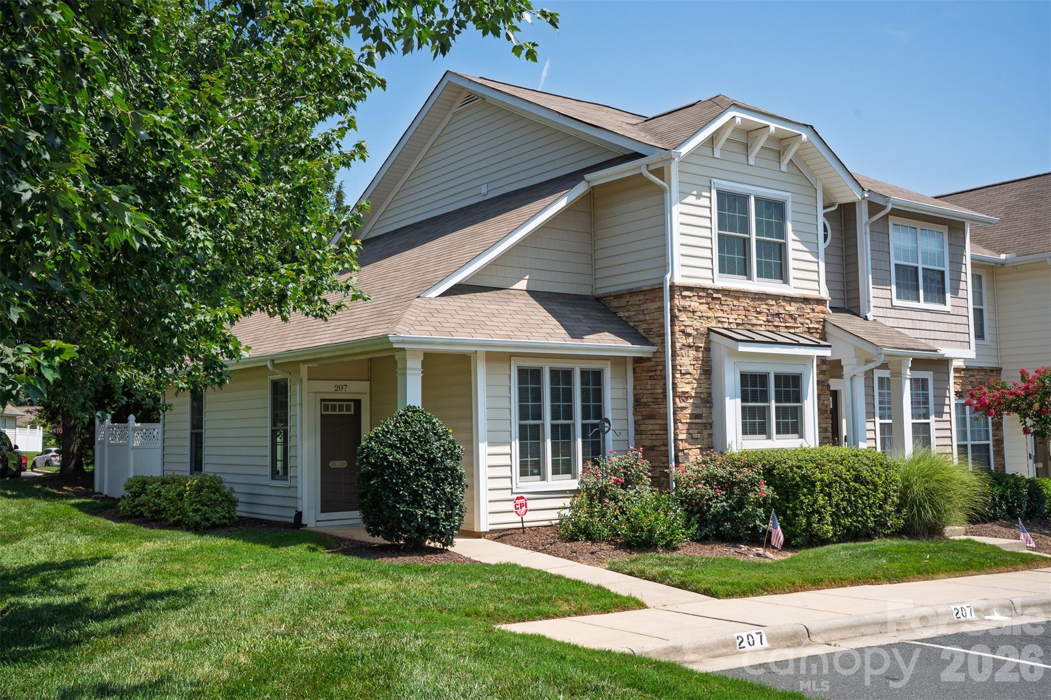 Discover low-maintenance living in this beautifully updated end-unit townhome in the Fieldstone! Offering over 1,300 square feet, this 3-bedroom, 2.5-bath home combines thoughtful updates with an unbeatable location.

The open main level features newer flooring throughout and an updated kitchen with painted cabinetry, epoxy-coated countertops, new backsplash, and a functional layout that flows seamlessly into the living and dining areas. The main-level primary suite provides convenience and privacy, while the upgraded en-suite bathroom showcases a spacious walk-in tiled shower. Upstairs, two additional bedrooms and a full bathroom offer flexible space for guests, additional living areas, or a home office.

Step outside to your backyard retreat featuring a generous stone patio and low-maintenance turf—perfect for relaxing, entertaining, or enjoying your morning coffee. As an end unit, you'll appreciate the extra space and natural light.

The HOA takes care of the exterior maintenance, lawn care, community pool, and clubhouse, making it easy to spend more time enjoying your home and less time maintaining it. 

Conveniently located less than one mile from grocery stores, restaurants, fitness centers, banks, and everyday essentials, this home is also under three miles from I-77, providing quick access to Charlotte. Uptown Charlotte and the Airport are both less than 20 miles away, making commuting and travel a breeze.

Whether you're searching for your first home, looking to downsize, or simply wanting a move-in-ready home in the award-winning Fort Mill School District, this one checks all the boxes!