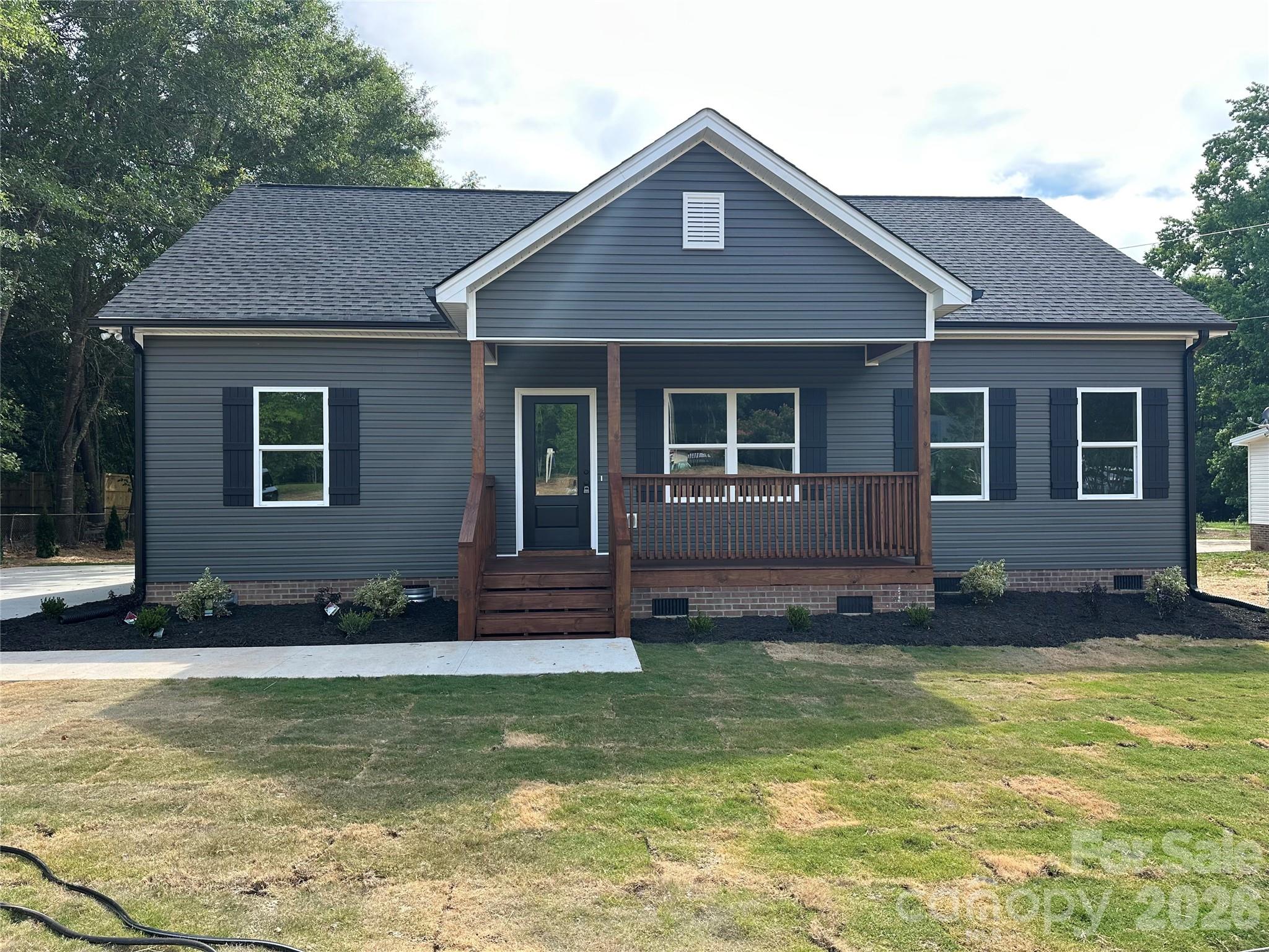 Beautiful New Construction! This beautiful 3-bedroom, 2-bath home offers 1,636 sq. ft. of thoughtfully designed living space on 1.00 acre. Enjoy an open floor plan with a spacious great room, luxury vinyl plank flooring, and covered front porch perfect for relaxing. The modern kitchen features granite countertops, white shaker cabinets, and included appliances. The private primary suite boasts a walk-in closet and beautiful bath for your comfort. All-electric utilities, well and septic, and no HOA or restrictions give you freedom and convenience. Just minutes from I-77 for an easy commute. Move-in ready by May 15, 2026!