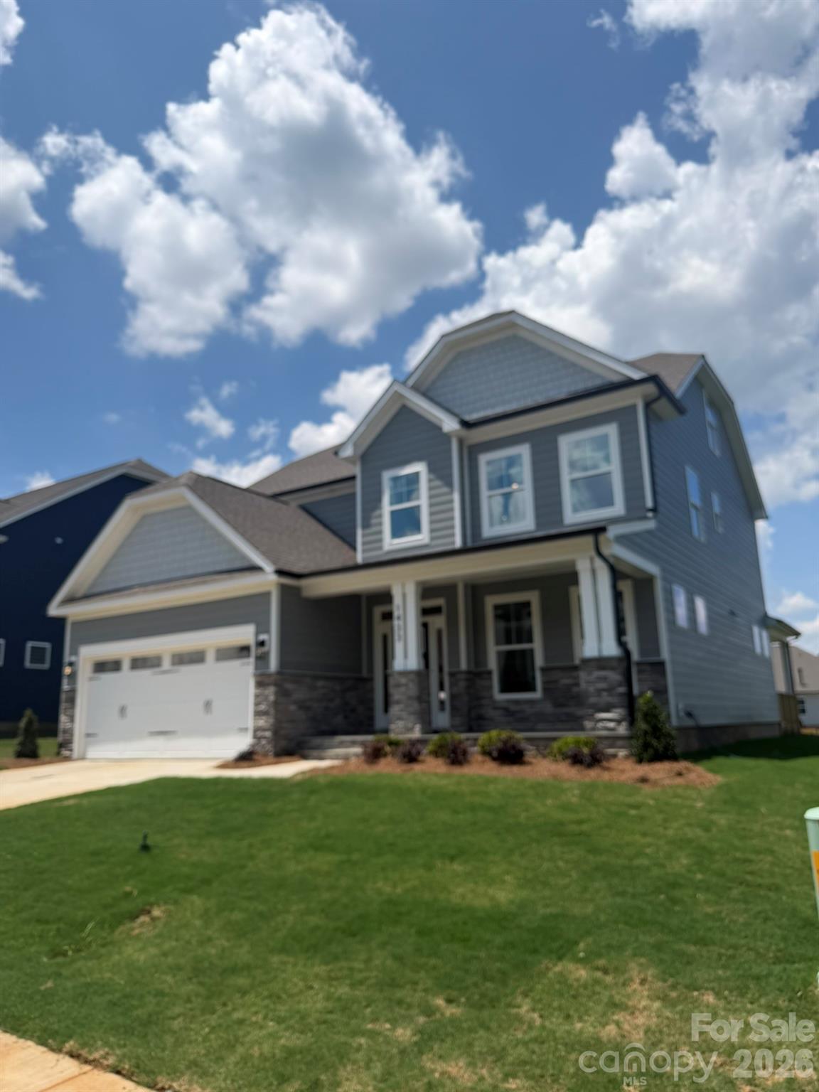 Welcome to new construction near the scenic Catawba River in Rock Hill! This 3-story Cypress plan offers 5 bedrooms, 4 full baths & more than 2,800 square feet of living space. The main level includes an office with French doors. a guest bedroom, guest bath with 4-ft shower with seat, the family room with a direct-vent, gas fireplace, breakfast area that walks out to the covered porch, and the designer kitchen. The kitchen features a large island, white cabinets, quartz countertops, tile backsplash, stainless range hood & stainless appliances, including a gas cooktop and wall oven. The upstairs primary bathroom features a tub with tile surround, a tiled shower with semi-frameless door, double-bowl vanity, and a linen closet. The upper level also has two secondary bedrooms, a full bath with a tub/shower combo, a loft, and convenient laundry room. Living space continues to the third floor with a spacious bedroom and full bath. Visit today and meet your dream home!