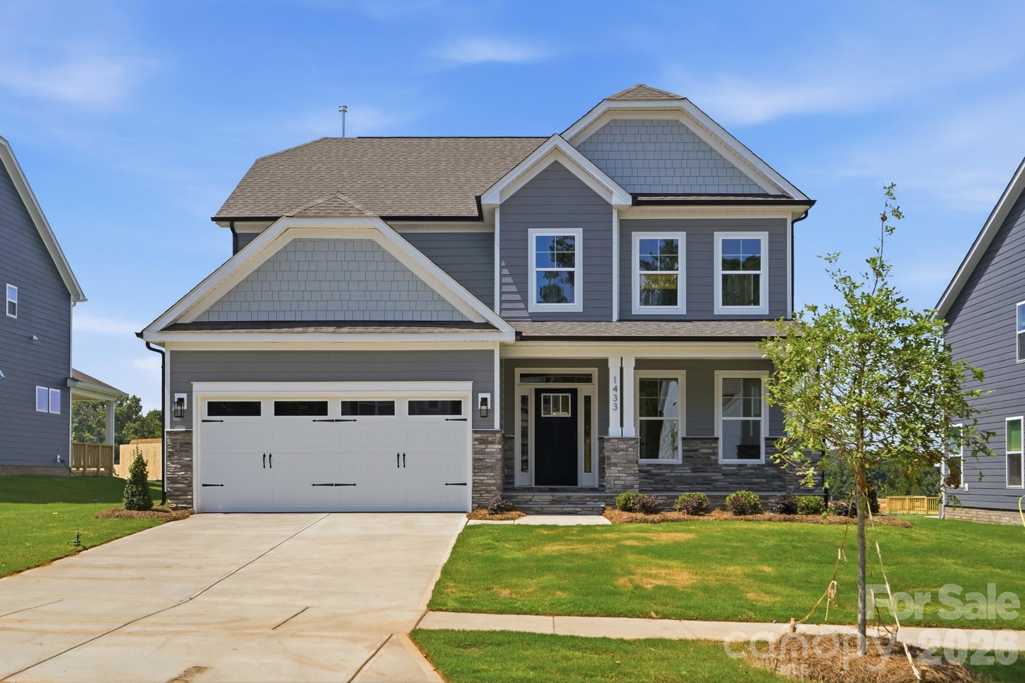 Welcome to new construction near the scenic Catawba River in Rock Hill! This 3-story Cypress plan offers 5 bedrooms, 4 full baths & more than 2,800 square feet of living space. The main level includes an office with French doors. a guest bedroom, guest bath with 4-ft shower with seat, the family room with a direct-vent, gas fireplace, breakfast area that walks out to the covered porch, and the designer kitchen. The kitchen features a large island, white cabinets, quartz countertops, tile backsplash, stainless range hood & stainless appliances, including a gas cooktop and wall oven. The upstairs primary bathroom features a tub with tile surround, a tiled shower with semi-frameless door, double-bowl vanity, and a linen closet. The upper level also has two secondary bedrooms, a full bath with a tub/shower combo, a loft, and convenient laundry room. Living space continues to the third floor with a spacious bedroom and full bath. Visit today and meet your dream home!