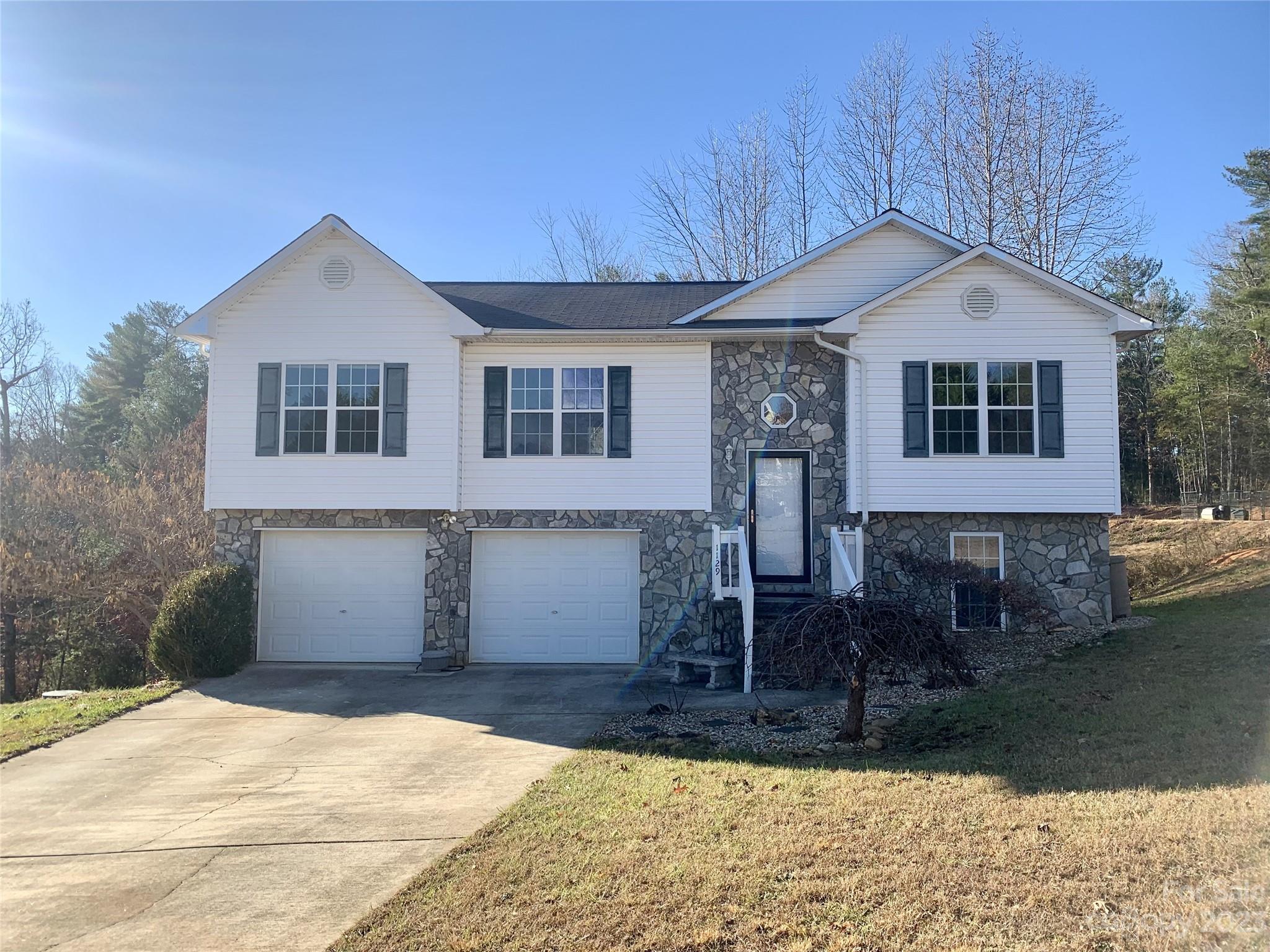 Make your New Year's resolution a reality! Become a homeowner in 2024 with this lovely home in quiet neighborhood with beautiful views. This home is one of the largest models in the subdivision. Split bedroom floor plan with main floor laundry. No going out to the garage! Large, oversized 2 car garage. Custom stone steps leading to front door. Step outside the french doors to the large deck on rear of home with Trex steps. Radon mitigation system installed. Basement has been painted and has flooring installed and could easily be finished or use as is as a craft room, play room, or any other purpose you desire. Less than 10 minutes to picturesque Lake James, 15 minutes to Historic Downtown Morganton. Make it your own today!