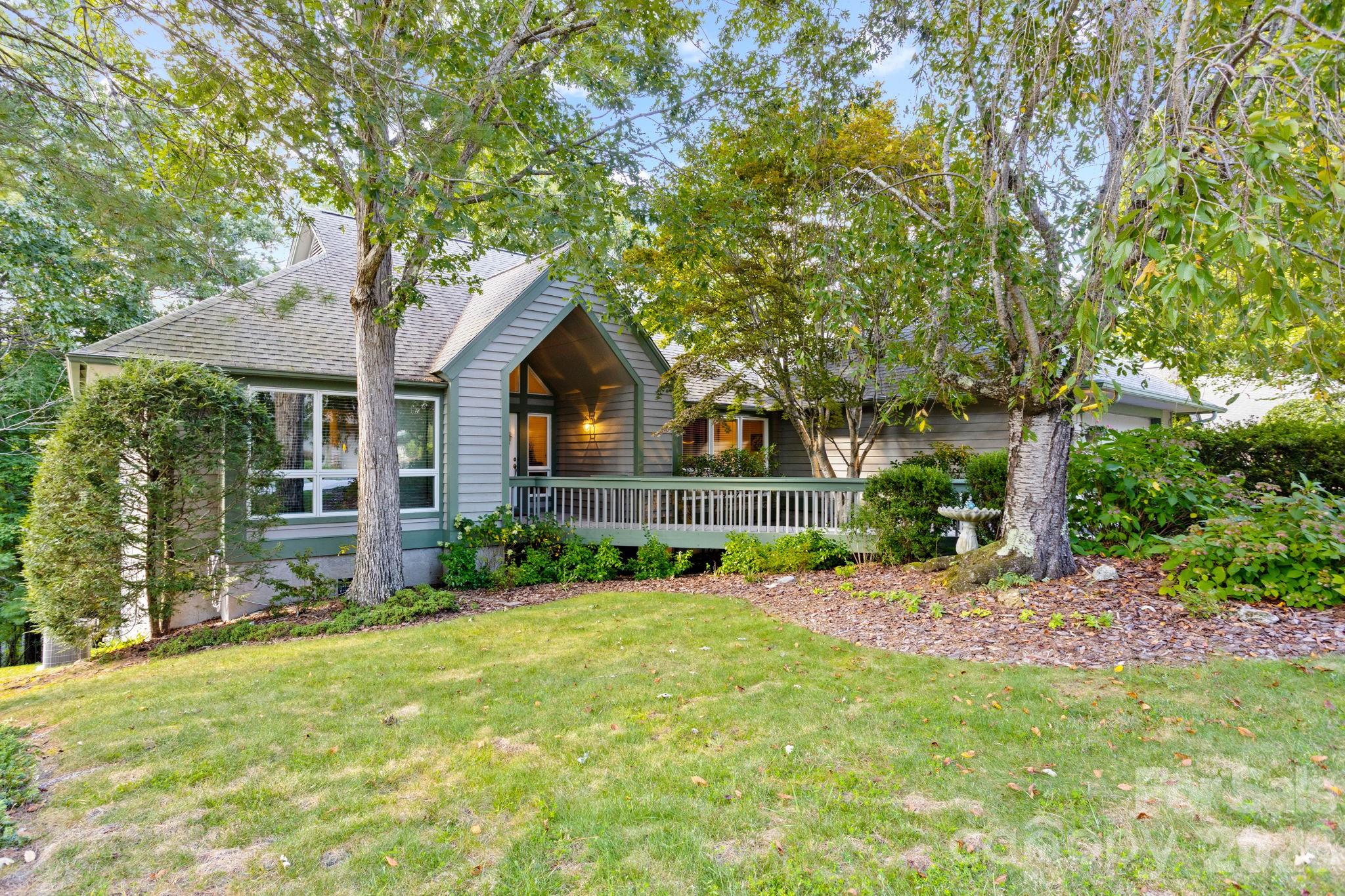 Welcome to this exceptional one level freestanding villa nestled in the highly desirable and private setting of Kenmure- a premier gated golf course community in the heart of Flat Rock, NC. This freestanding 3 bedroom, 2 bath home offers the perfect blend of privacy, comfort and convenience- all just seconds from the entry gate and all of Kenmure’s world-class amenities. Step into the elegant foyer with cathedral ceiling and marble flooring, leading into the spacious great room with vaulted ceilings, a wall of windows that flood the space with natural light and a gas fireplace with marble surround. The floor plan seamlessly connects the great room, dining area and kitchen- ideal for both everyday living and entertaining. The spacious gourmet kitchen features granite countertops with tile backsplash, stainless steel appliances, island and plenty of cabinet and counter space. The primary suite features a large walk-in closet and ensuite bath with double vanities, make-up area, walk-in shower and garden tub. A cozy den/office provides the perfect space for a home office or TV room. Two additional bedrooms and a full bath offer plenty of space for family or guests. Enjoy outdoor mountain living at its best while relaxing in the sunroom, sitting or grilling on the open deck with gas line or the front porch. This villa’s prime location, layout and setting make it a truly rare find.