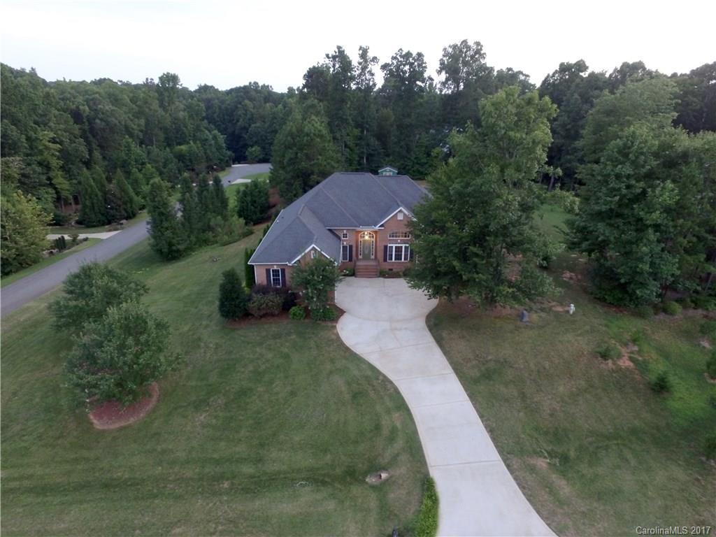 Gorgeous custom built home in highly sought out Brantley Oaks community in Waxhaw. Almost an acre lot, this well maintained home boasts an open floorplan w/ vaulted ceilings. Huge kitchen w/ 42" cabinets, granite countertops and upgraded stainless steel gas Viking rangetop.  ENORMOUS walk in pantry. Hardwood and tile throughout. HEATED/SALTWATER pool w/ large cabana. See Video Tour in UHD. www.reeltour.biz/5601timberfalls